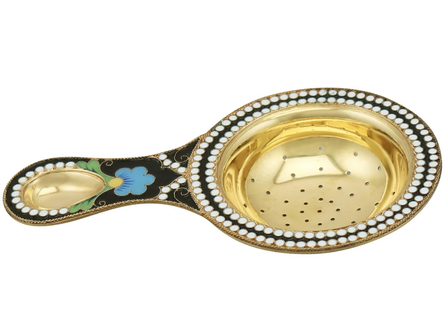 An exceptional, fine and impressive vintage Russian silver gilt and polychrome cloisonné enamel tea strainer; an addition to our silver tea ware collection.

This exceptional vintage Russian silver gilt and polychrome cloisonné enamel tea strainer