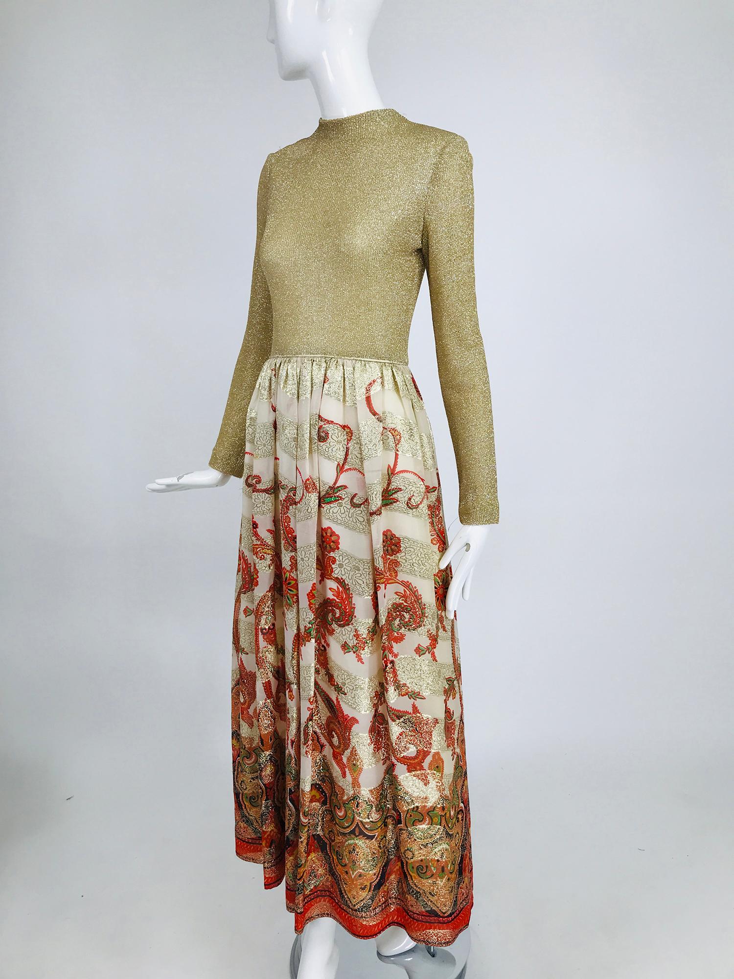 Vintage 1970s Saks Fifth Ave. gold metallic knit and coral brocade maxi dress. Mock neck, fitted bodice, long sleeve top with a narrow welt cord waist band, the long skirt is woven of gold metallic chiffon brocade, with floral swirls of coral and