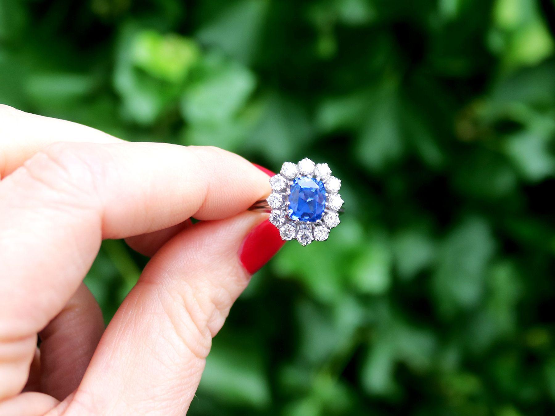 A stunning 4.40 carat Ceylon sapphire and 0.96 carat diamond , 18 karat white gold cluster style cocktail ring; part of our diverse vintage jewelry and estate jewelry collections.

This stunning, fine and impressive blue sapphire and diamond ring