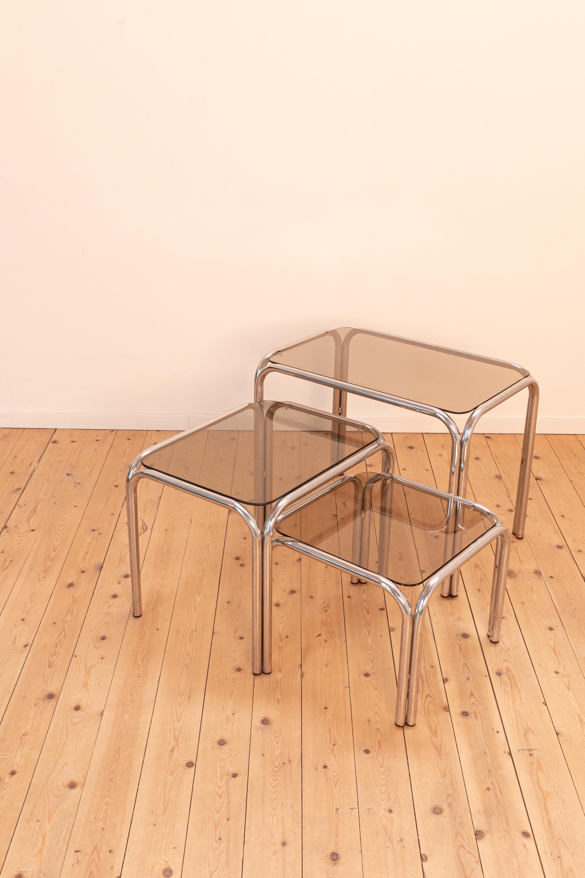 Late 20th Century Vintage 1970s set of 3 smoked glass side/nesting tables with tubular metal frame