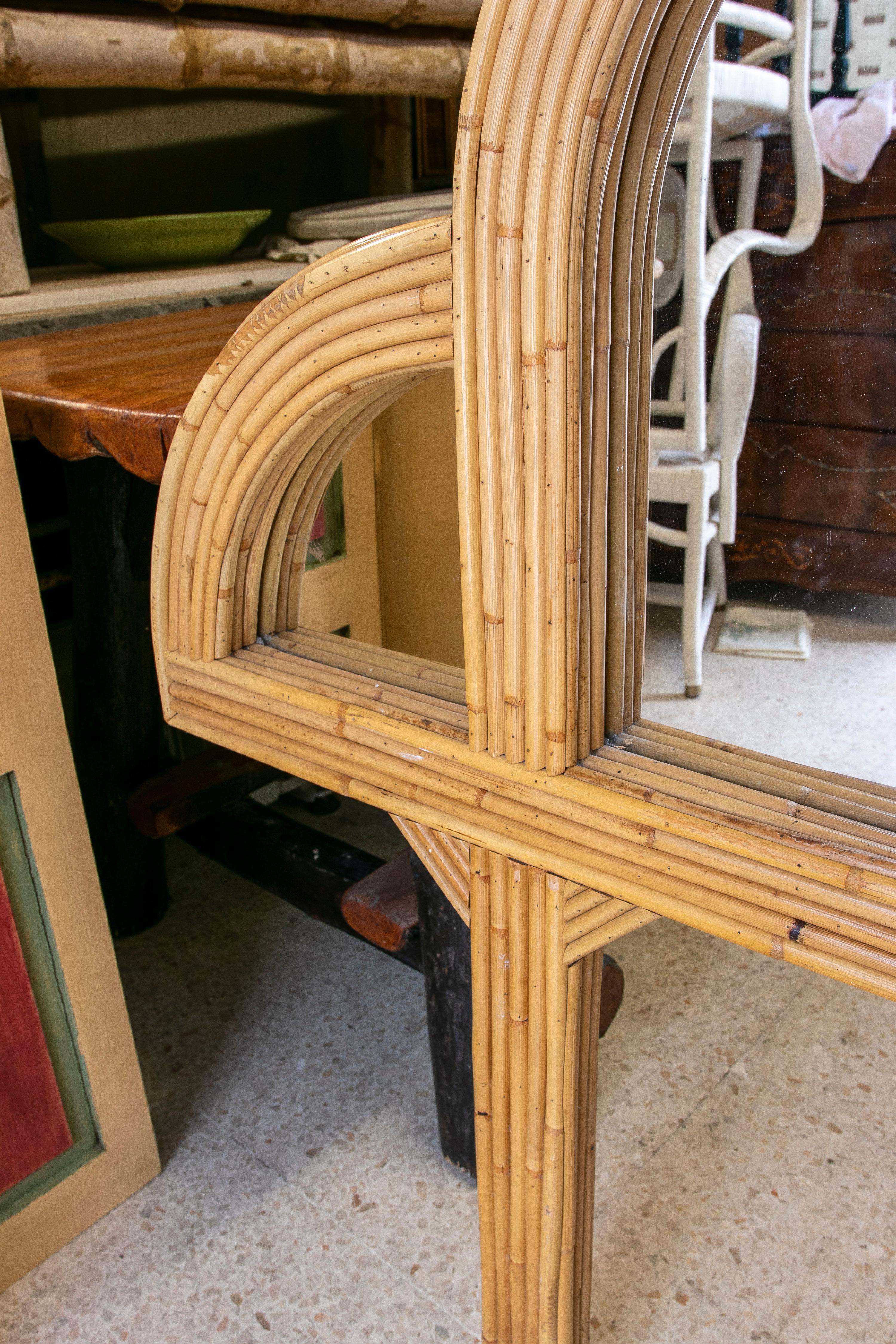 Vintage 1970s Spanish panelled mirror and bamboo lined wooden headboard.