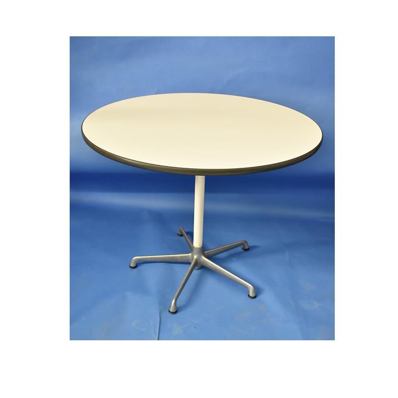 Vintage 1970s table, design by Herman Miller.

The table has an aluminum leg and a white laminate top.

On the edge there is a cut, visible in the photos
 