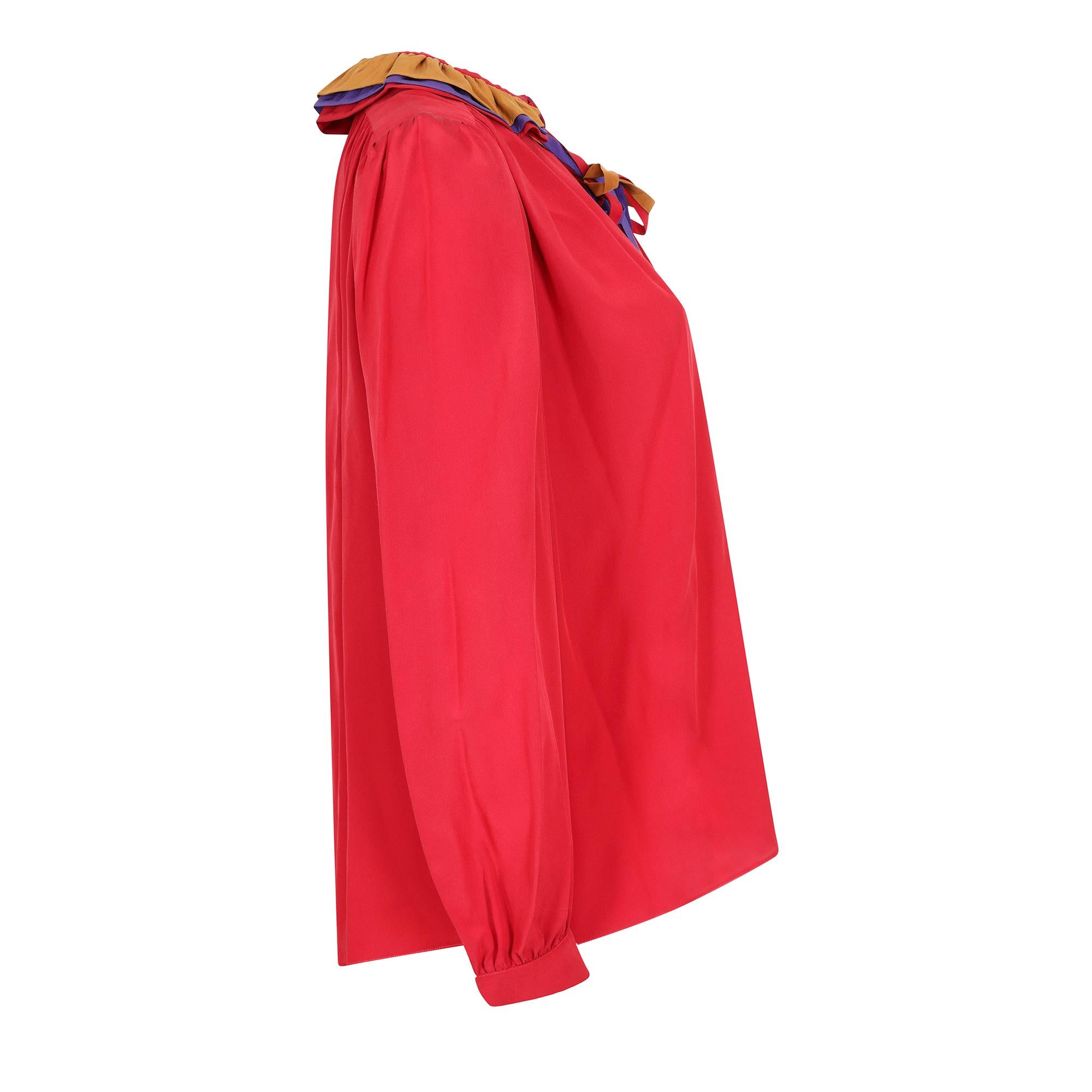 Original vintage Ted Lapidus ruffle collar red silk blouse. A great example of 1970s day wear from this renowned but under the radar French designer. The blouse has a poet look about it with generous amounts of fabric in the bodice and sleeves. This