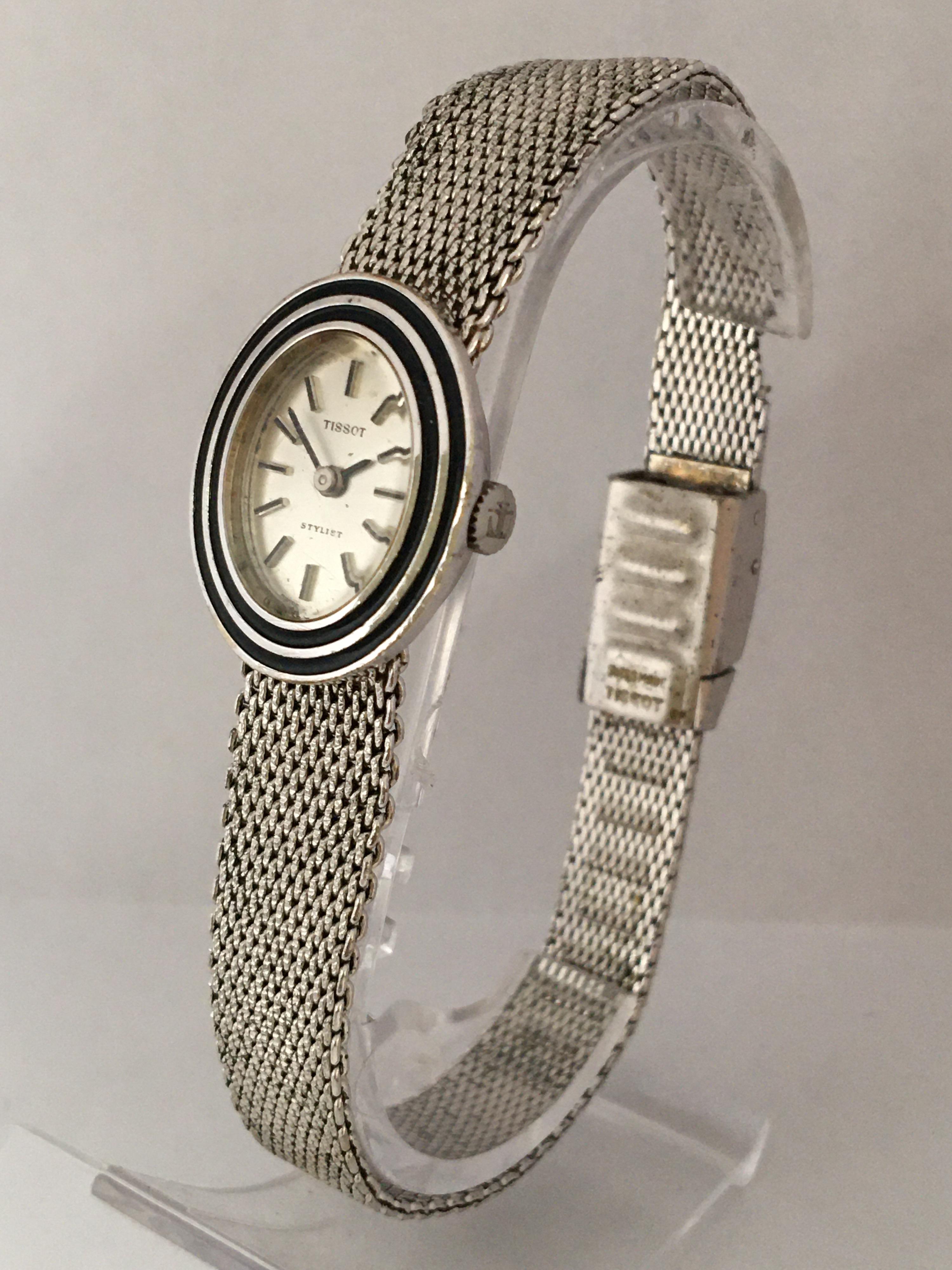 This vintage pre-owned hand-winding watch is working and it is ticking well. 

There are some signs of ageing and wear some scratches on the watch case. The silver plated band is tarnished as shown. 

Please study the images carefully as form part
