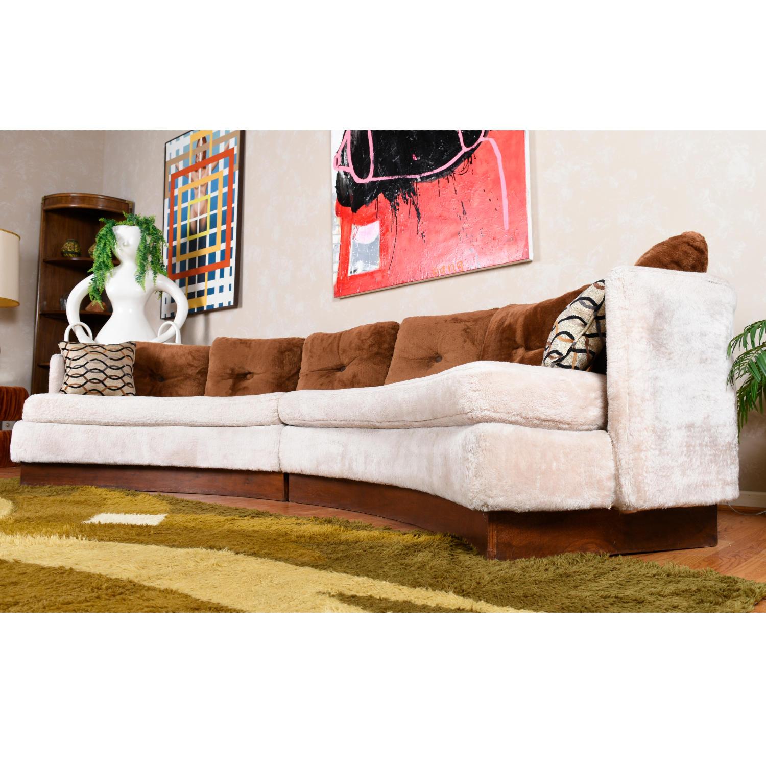 Vintage 1970s curved Mid-Century Modern crescent shaped sofa. The sofa boasts it’s original fuzzy beige and brown upholstery. Around here we call it the “Teddy Bear Sofa.” No worry for comfort with the plush pillows and fabric. Plenty of room for