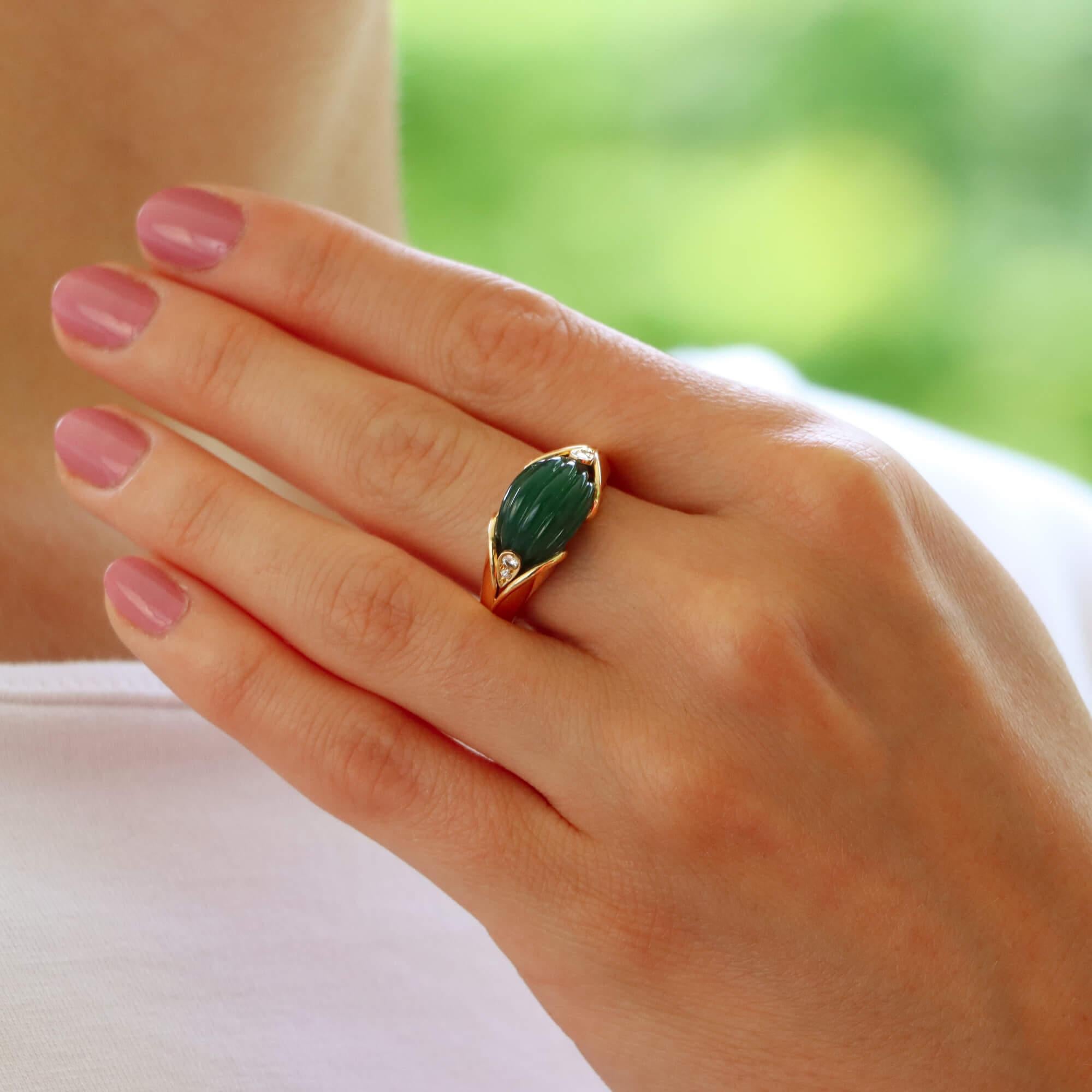 A beautiful vintage Van Cleef and Arpels diamond and chrysoprase dress ring set in 18k yellow gold.

The ring centrally features a deep green chrysoprase stone which has been beautifully hand carved in a fluted ridged motif. The chrysoprase is