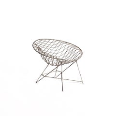 Vintage 1970s wire arm chair with beautiful patina