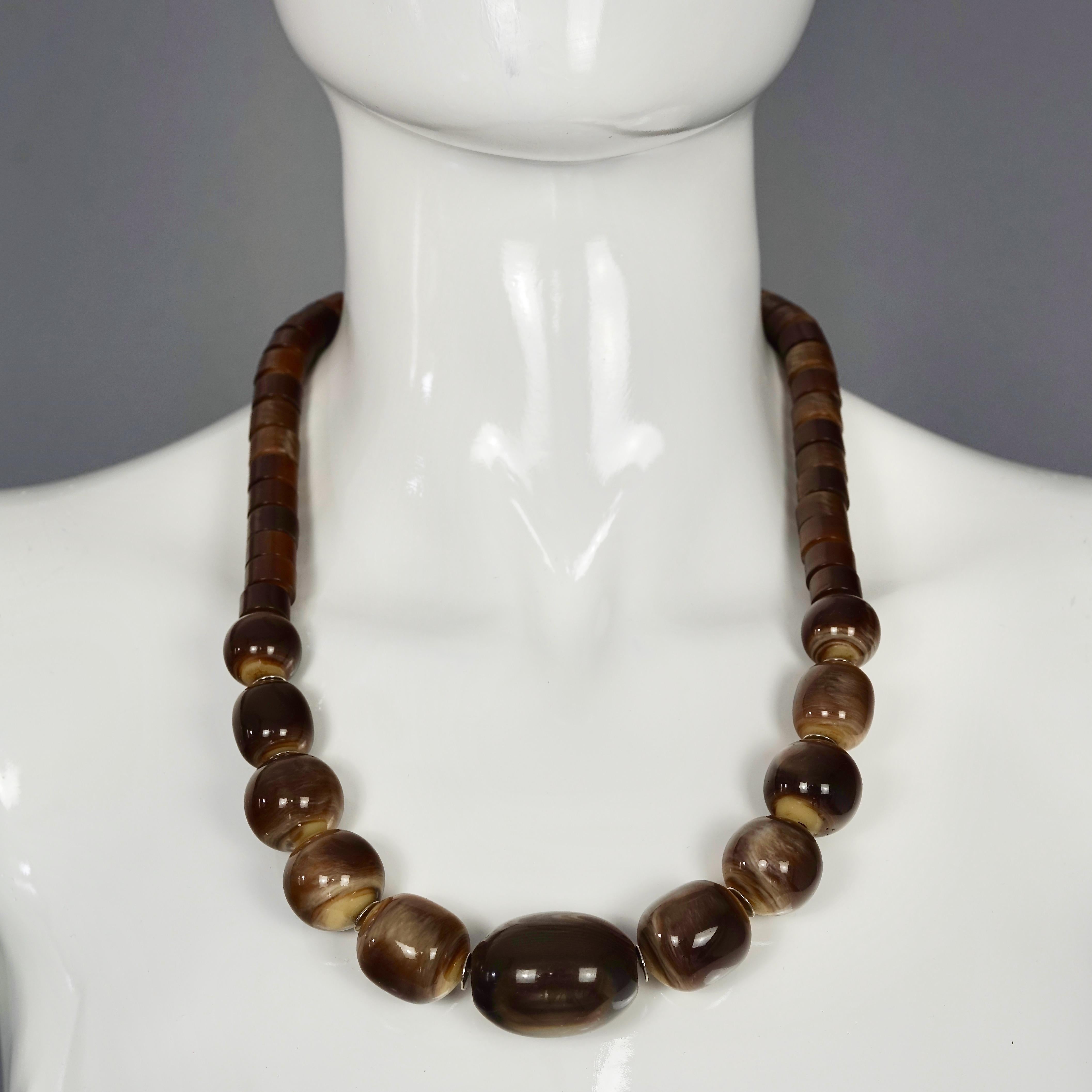 Vintage 1970s YVES SAINT LAURENT Ysl Tigers Eye Necklace by Roger Scemama

Measurements:
Height: 1.06 inches (2.7 cms)
Wearable Length: 23.22 inches (59 cm) until 24.40 inches (62 cm)

Features:
- 100% Authentic YVES SAINT LAURENT by Roger