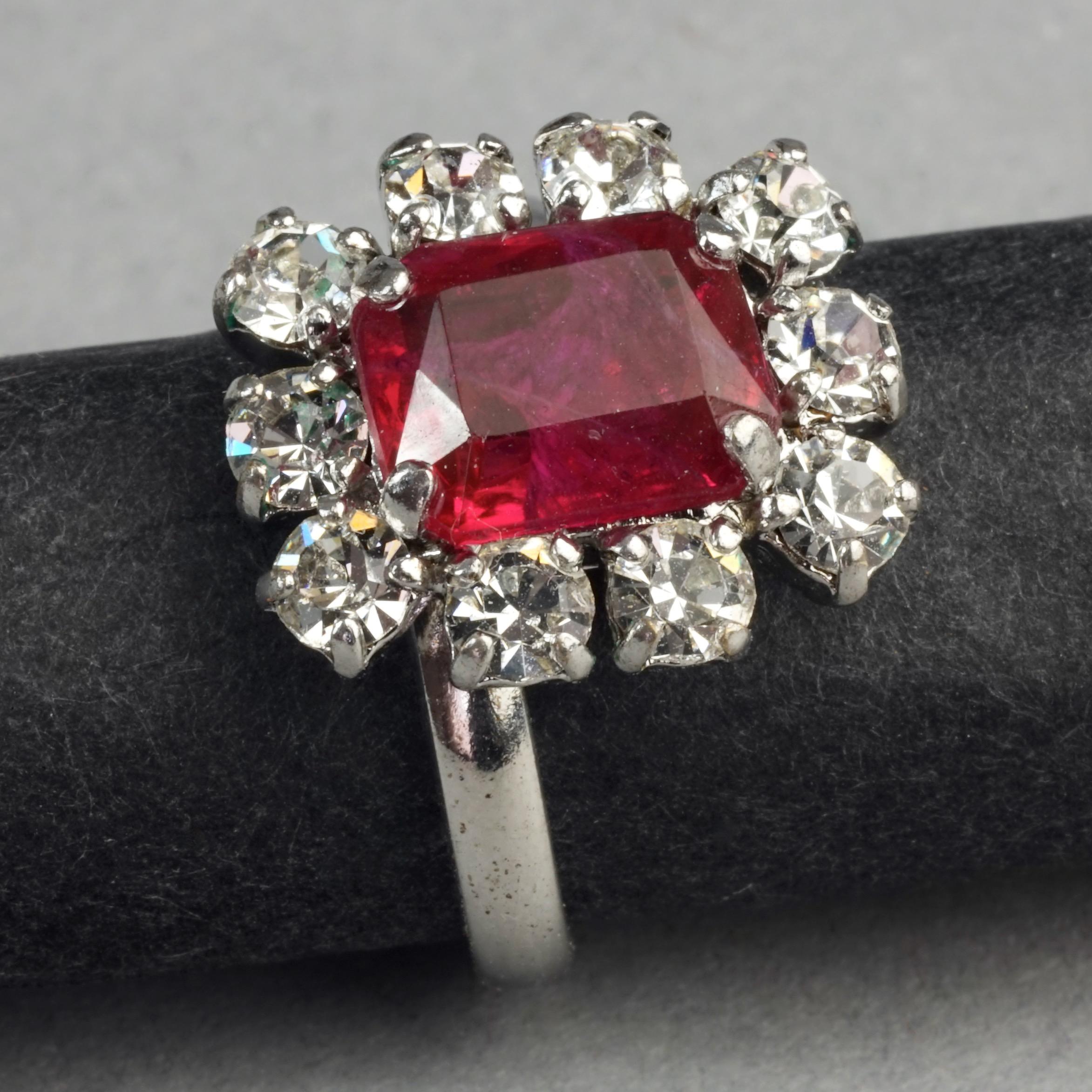 Vintage 1971 CHRISTIAN DIOR Red Rhinestone Ring

Measurements:
SIZE: 53FR/ 13US
Stone Height: 0.55 inch (1.7 cm)
Stone Width: 0.47 inch (1.5 cm)

Features:
- 100% Authentic CHRISTIAN DIOR.
- Faceted rectangle ruby red rhinestone, surrounded with