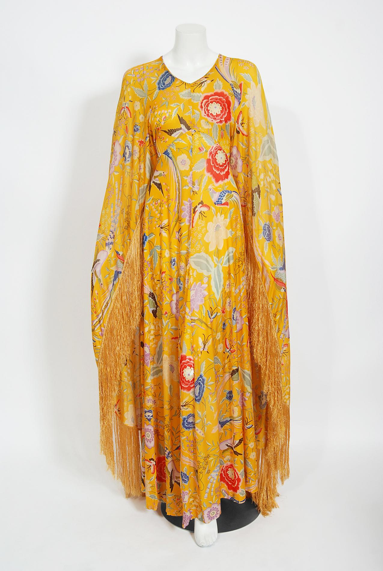 Breathtaking Missoni Couture documented iconic marigold-yellow floral bird garden print caftan gown from their 1971 collection. Such a rare and gorgeous color! Redefining an entire genre of fashion, the 1970's were seen as Missoni's launch to fame