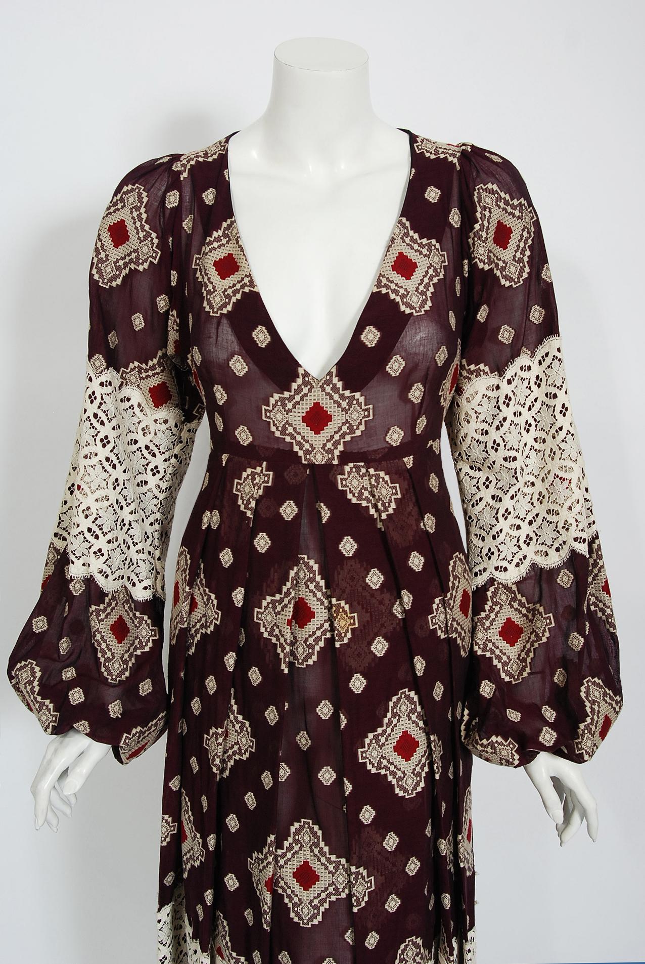 Gorgeous early-1970's Thea Porter designer couture dress fashioned in a magical plum purple cotton gauze brocade  that has red and ivory diamond medallions scattered over its surface. The stunning fabric has a touch of sheerness which I love. The