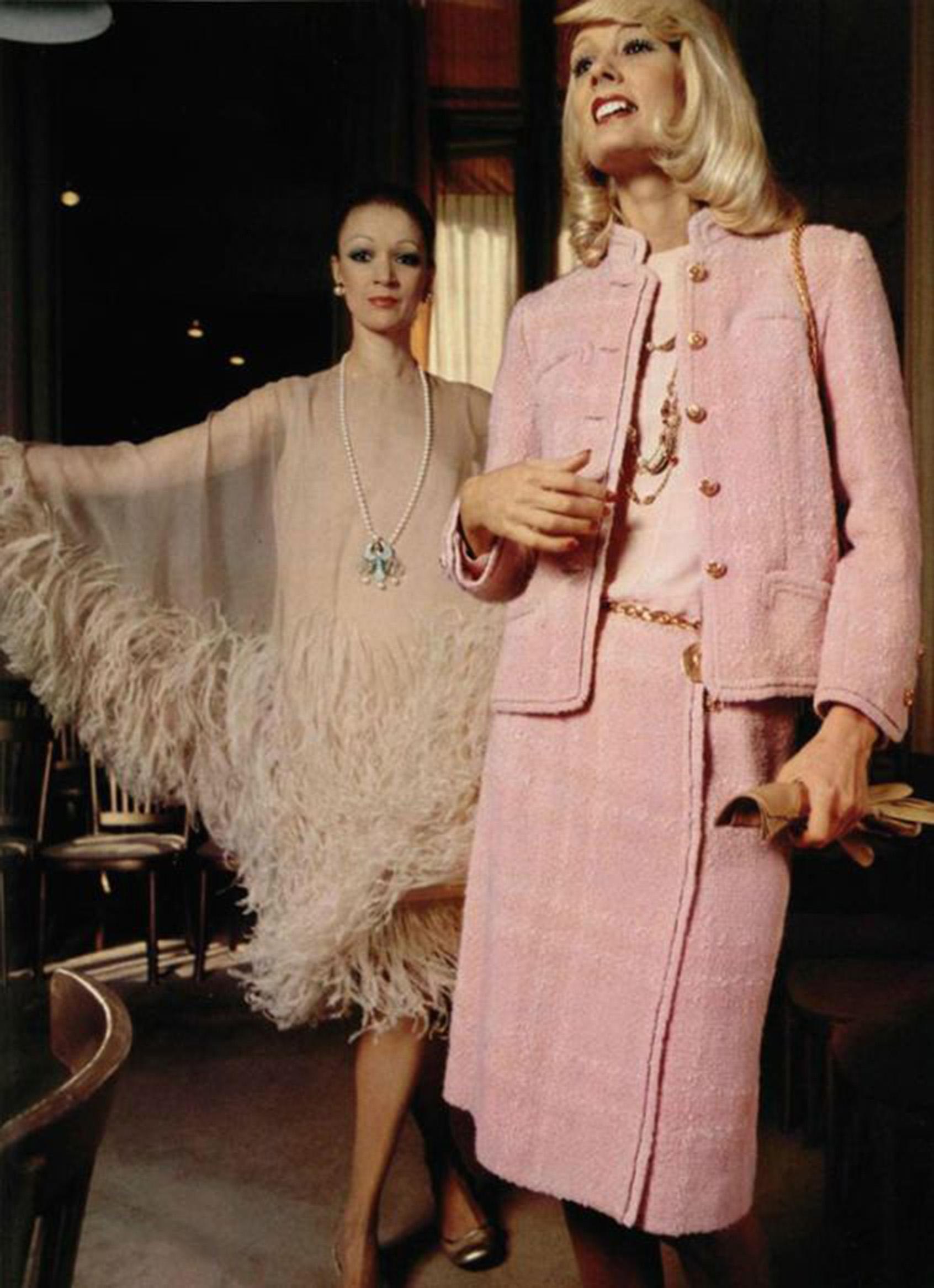 A highly coveted and instantly recognizable Chanel haute couture custom commissioned pink wool three piece suit from fall-winter 1973. This gorgeous baby pink color is such a rarity! The stunning ensemble is also very well-documented, having a full