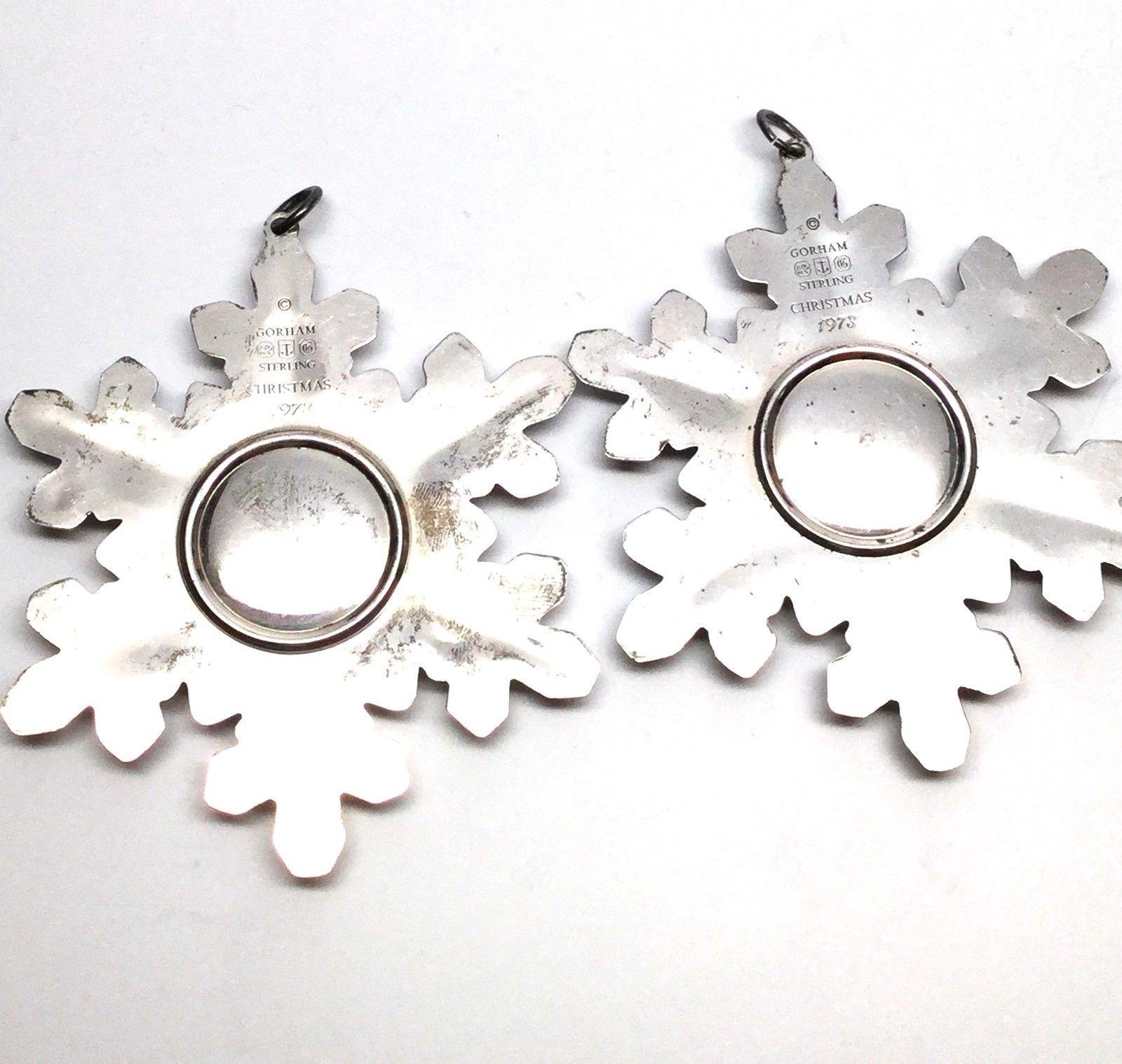 Two snowflake Christmas ornaments. These two vintage 1973 Gorham sterling silver snowflake Christmas ornaments are a beautiful addition for your collection! Measurements: 3 3/8