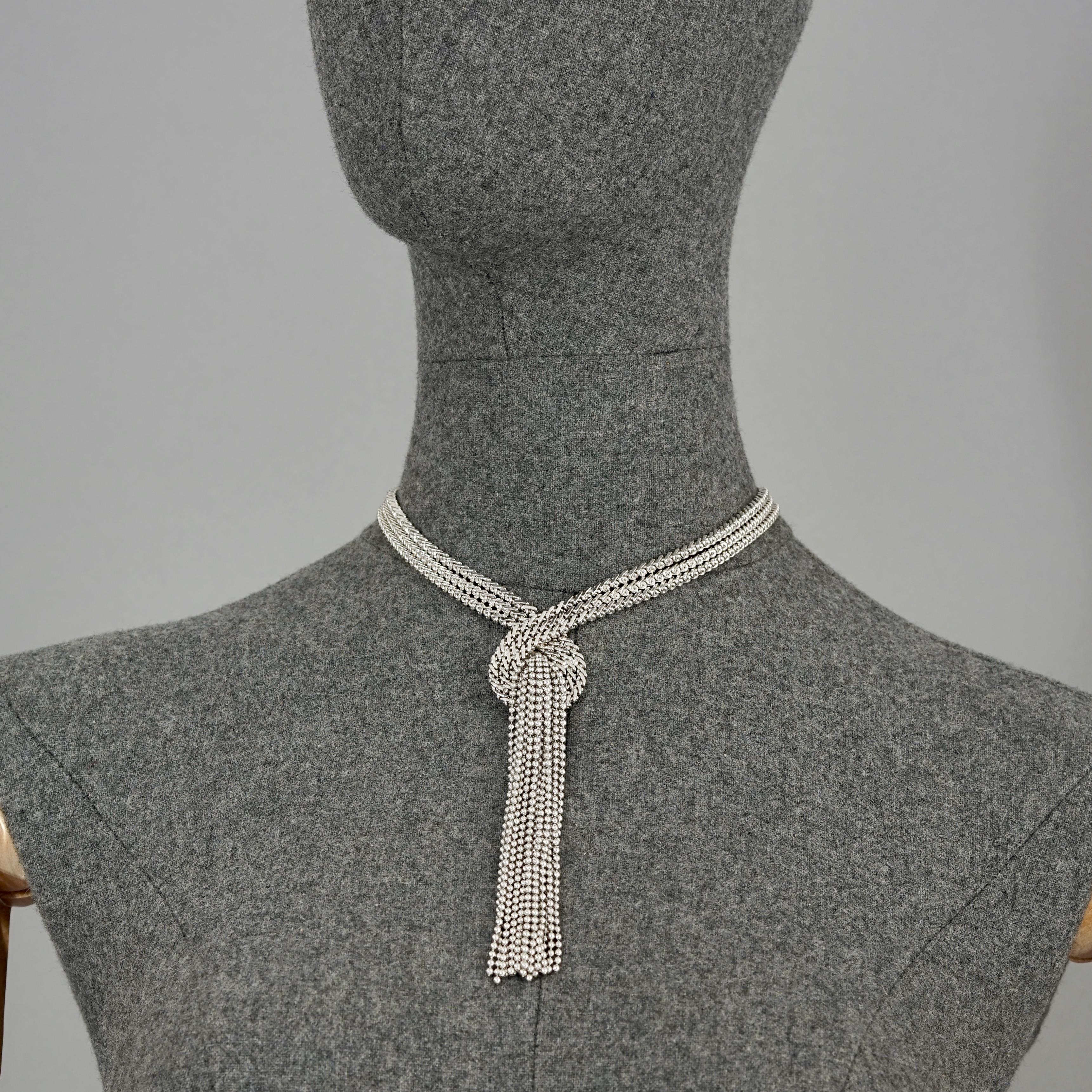 Vintage 1974 CHRISTIAN DIOR Cascading Multi Chain Tassel Silver Necklace

Measurements:
Center Height: 5.31 inches (13.5 cm)
Wearable Length: 15.94 inches (40.5 cm) maximum

Features:
- 100% Authentic CHRISTIAN DIOR.
- 3 Knotted chains with