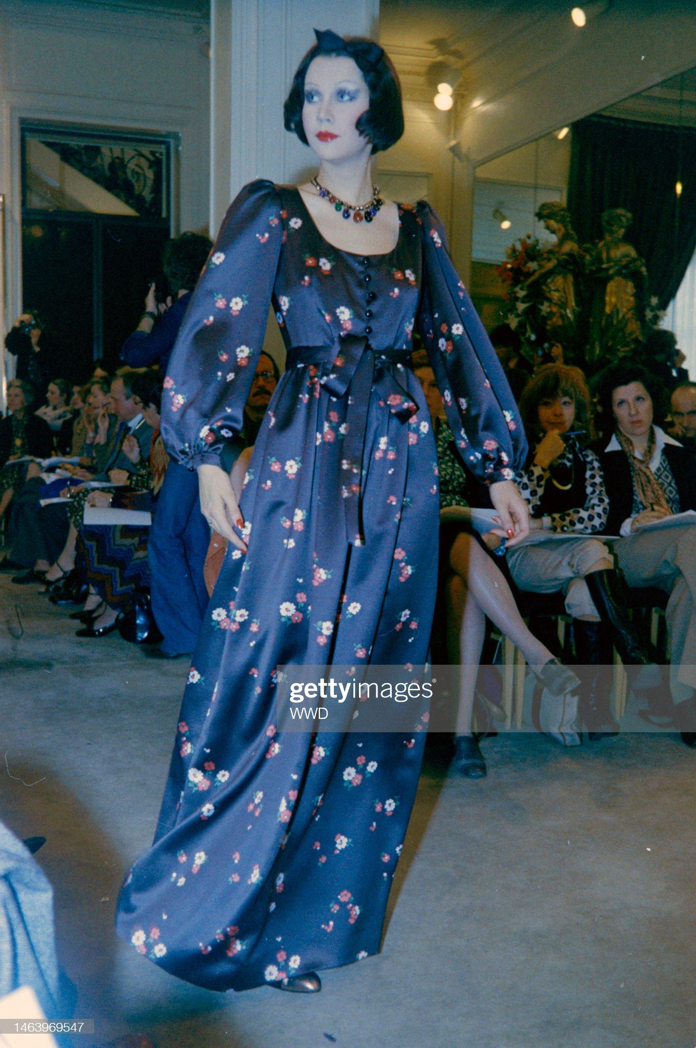 A gorgeous and highly coveted Yves Saint Laurent floral print maxi dress from the infamous Rive Gauche 1974 fall-winter collection. Finding documented pieces from this decade is very rare as these are true examples of fashion history. The fabric is