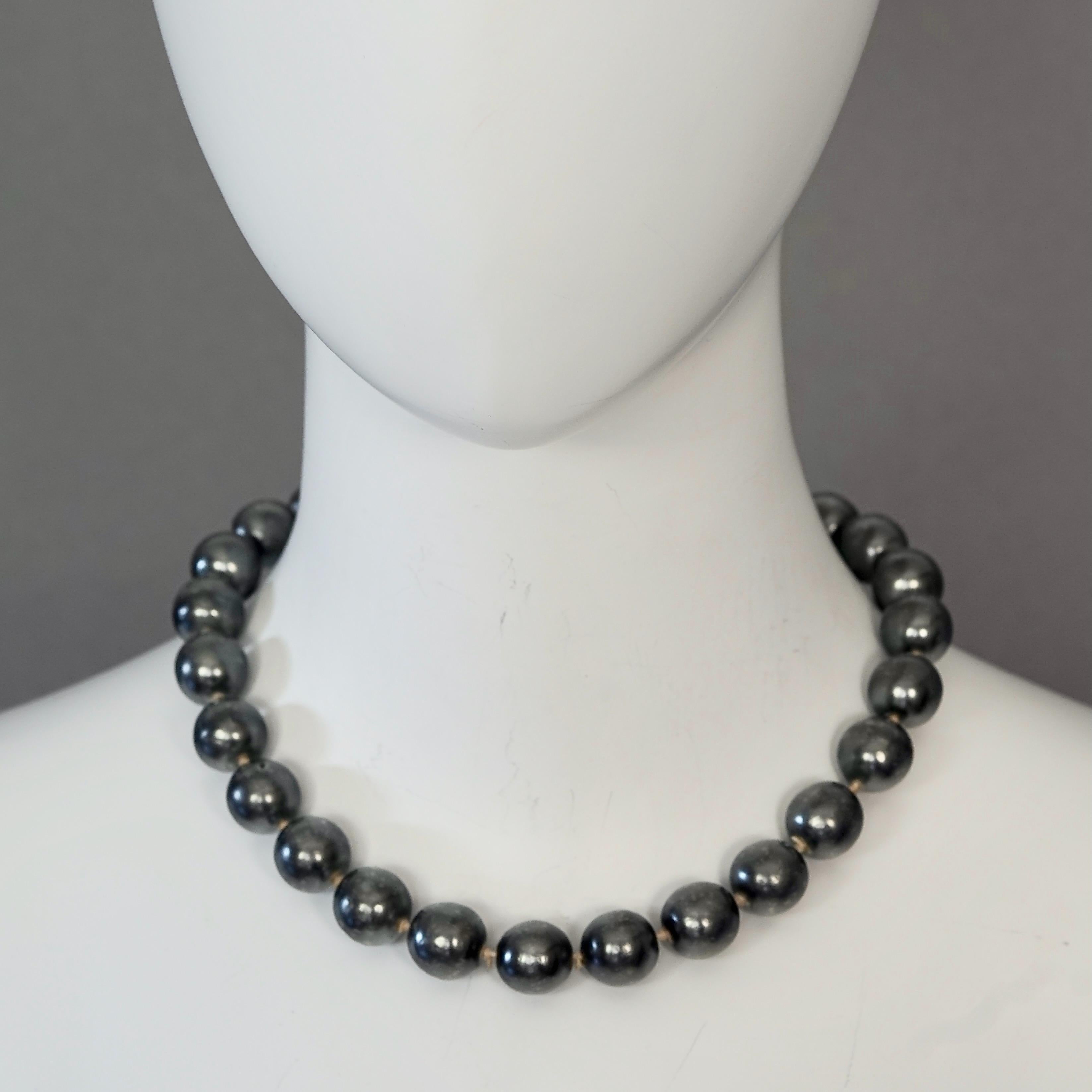 Vintage 1975 CHRISTIAN DIOR Silver Grey Glass Pearl Necklace

Measurements:
Pearls Diameter: 0.55 inch (1.4 cm)
Wearable Length: 17.12 inches (43.5 cm)

Features:
- 100% Authentic KARL LAGERFELD.
- Silver grey glass pearl choker necklace.
- Gold