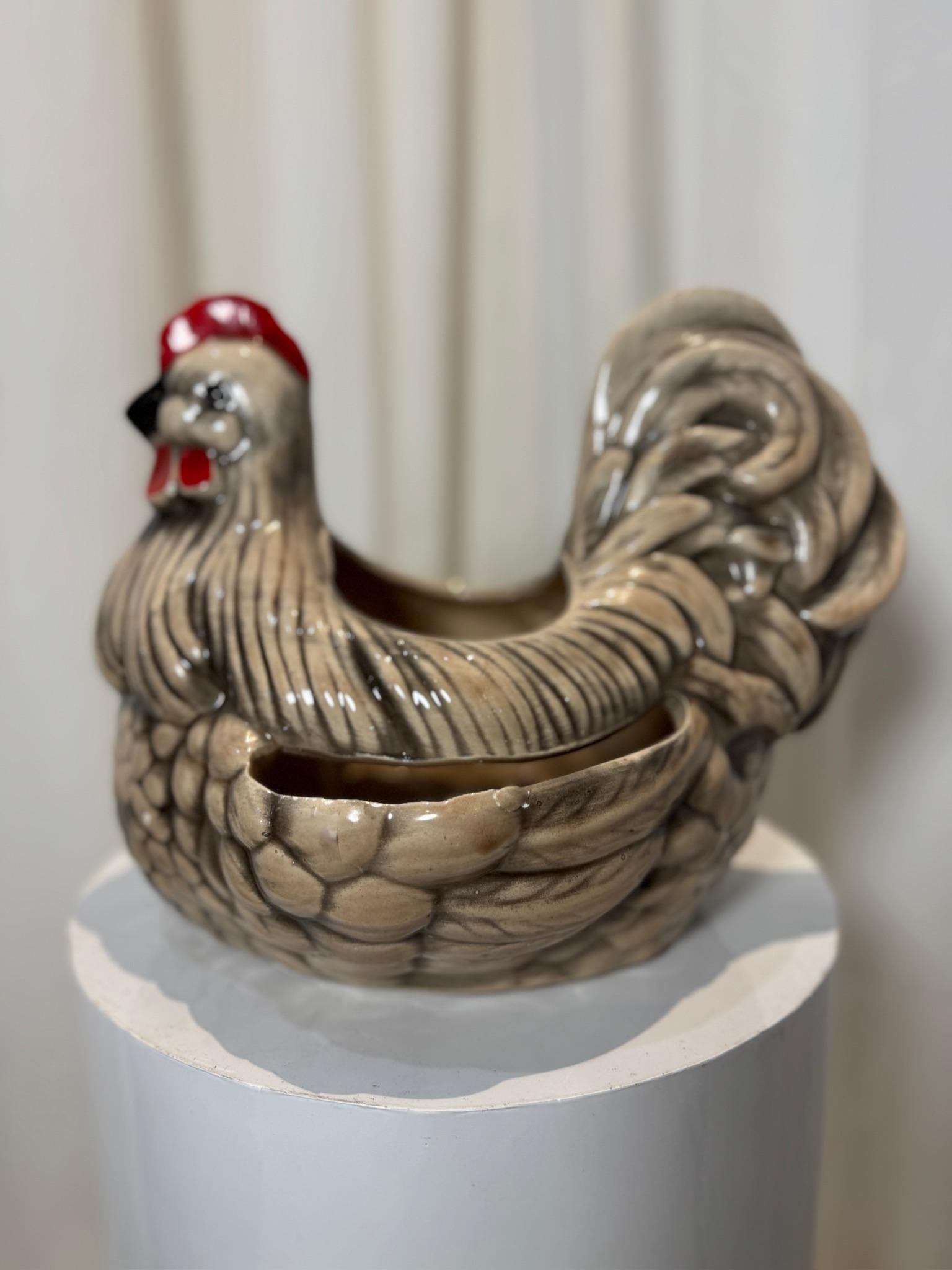 Add a touch of rustic charm to your home with this vintage ceramic rooster planter, beautifully crafted in the style of Arnel’s ceramics. Featuring a hand-painted, glossy glaze finish, this decorative piece showcases intricate feather detailing and