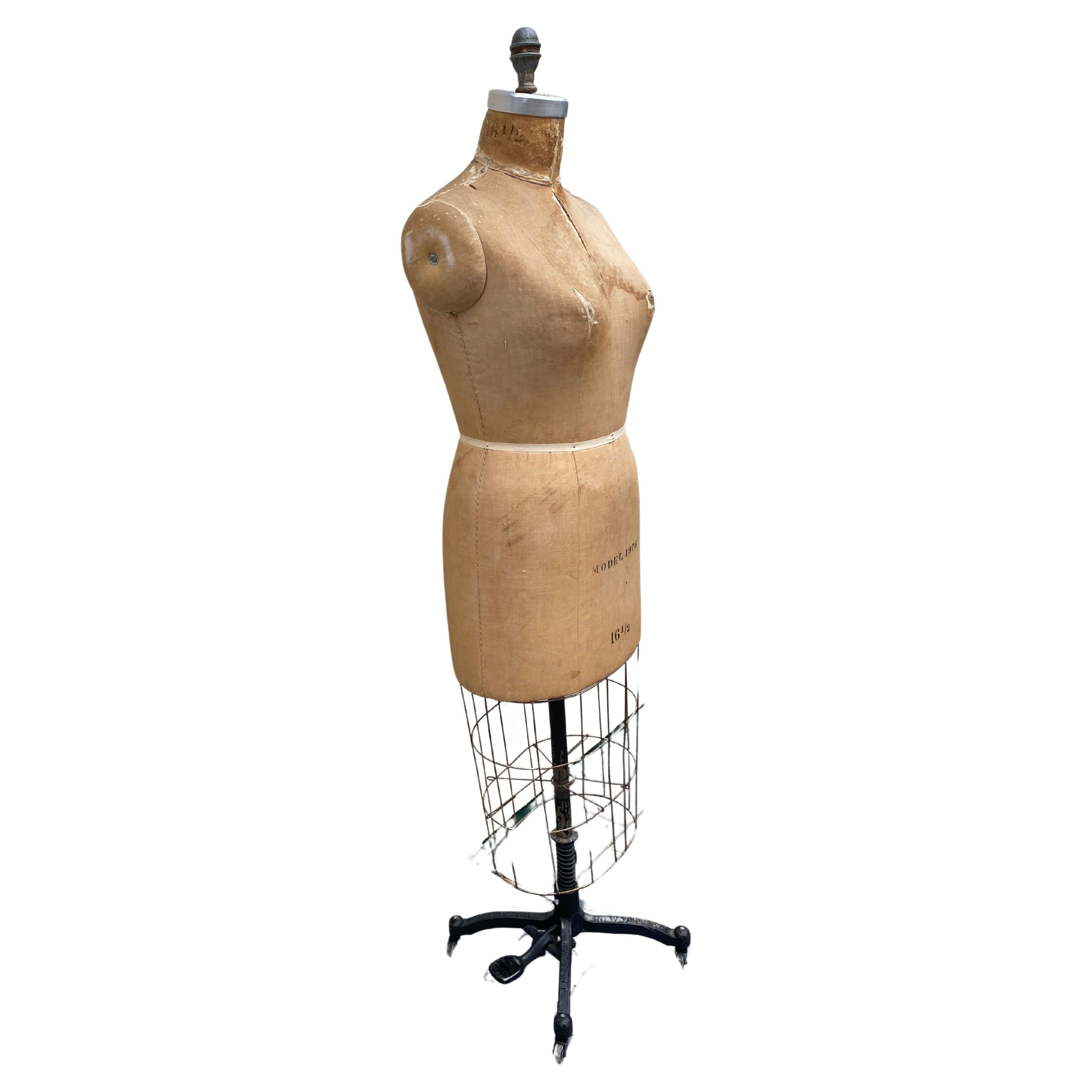 Vintage original J.R.Bauman 1976 dress form mannequin, New York.
Size 16.5 with signs of age appropriate wear on a cast iron base with casters. The form is wrapped in linen and layered with cotton batting over a papier-mâché base.  This is great