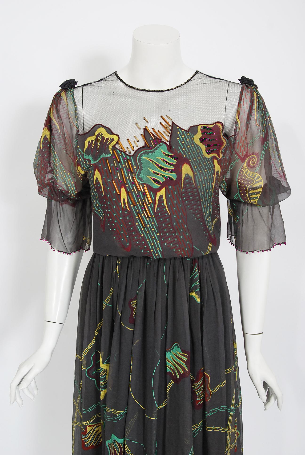 Zandra Rhodes was one of the British designers who put London at the forefront of the international fashion scene in the 1970's. This gorgeous dove grey hand-painted dress dates back to her 1977 couture collection. Her designs are considered
