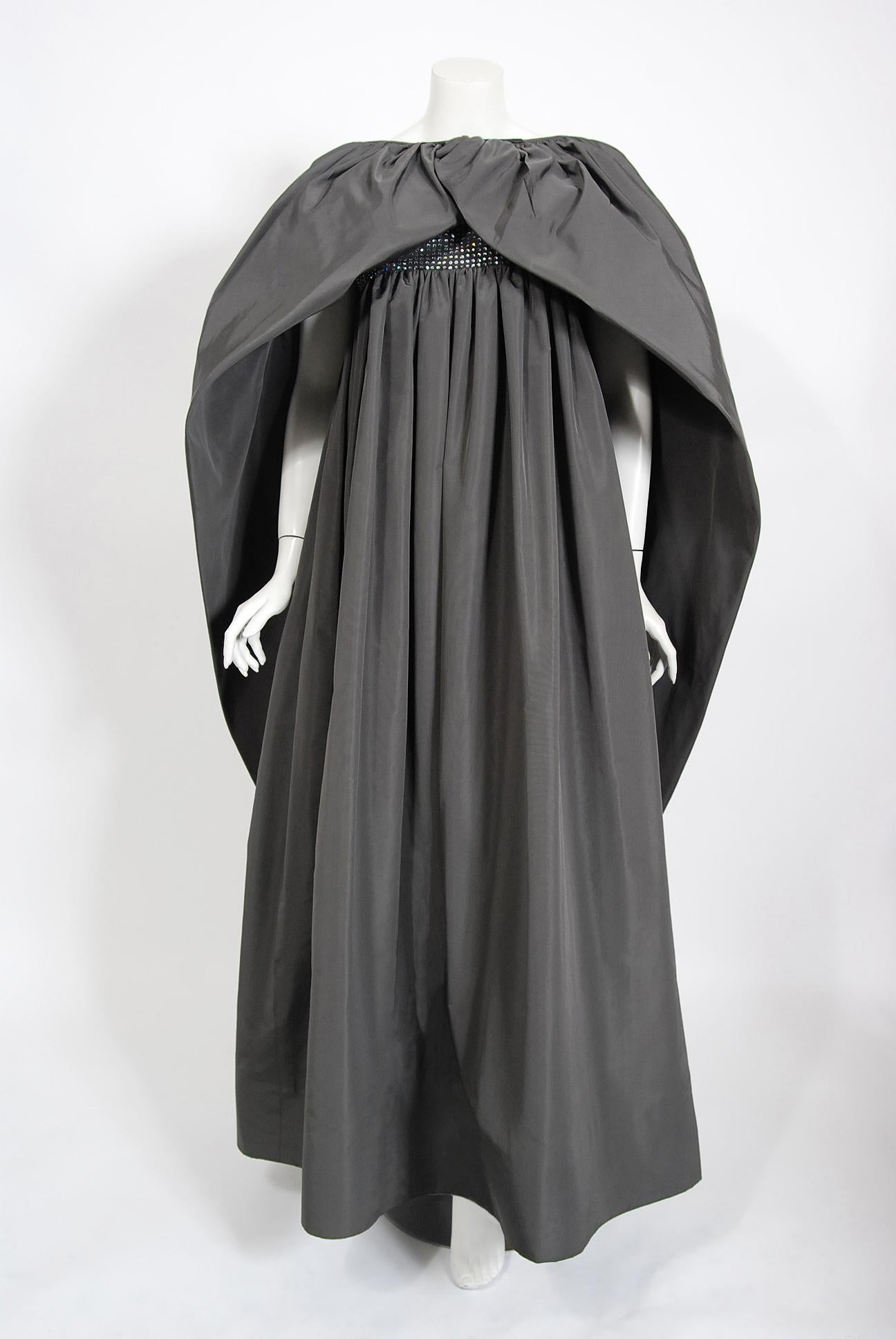 Spectacular Pierre Cardin haute couture gown and voluminous cape ensemble dating back to the his fall-winter 1978 collection  In 1951 Cardin opened his own couture house and by 1957, he started a ready-to-wear line; a bold move for a French