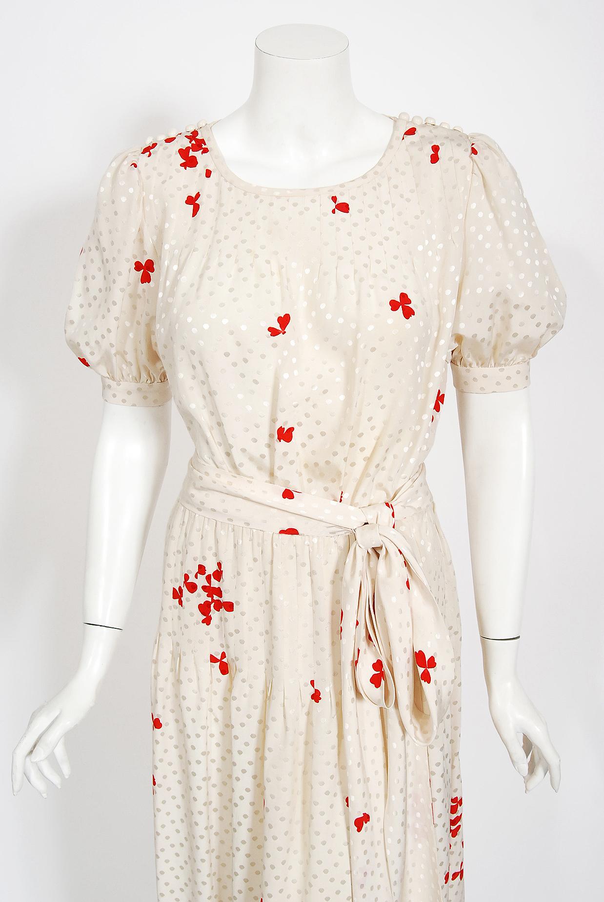 Gorgeous Yves Saint Laurent ivory dotted red-clover print silk dress ensemble from his 1978 spring/summer collection. Such a rarity to find all three pieces together! The dress is so chic with the shoulder buttons and short puff-sleeves. I adore the