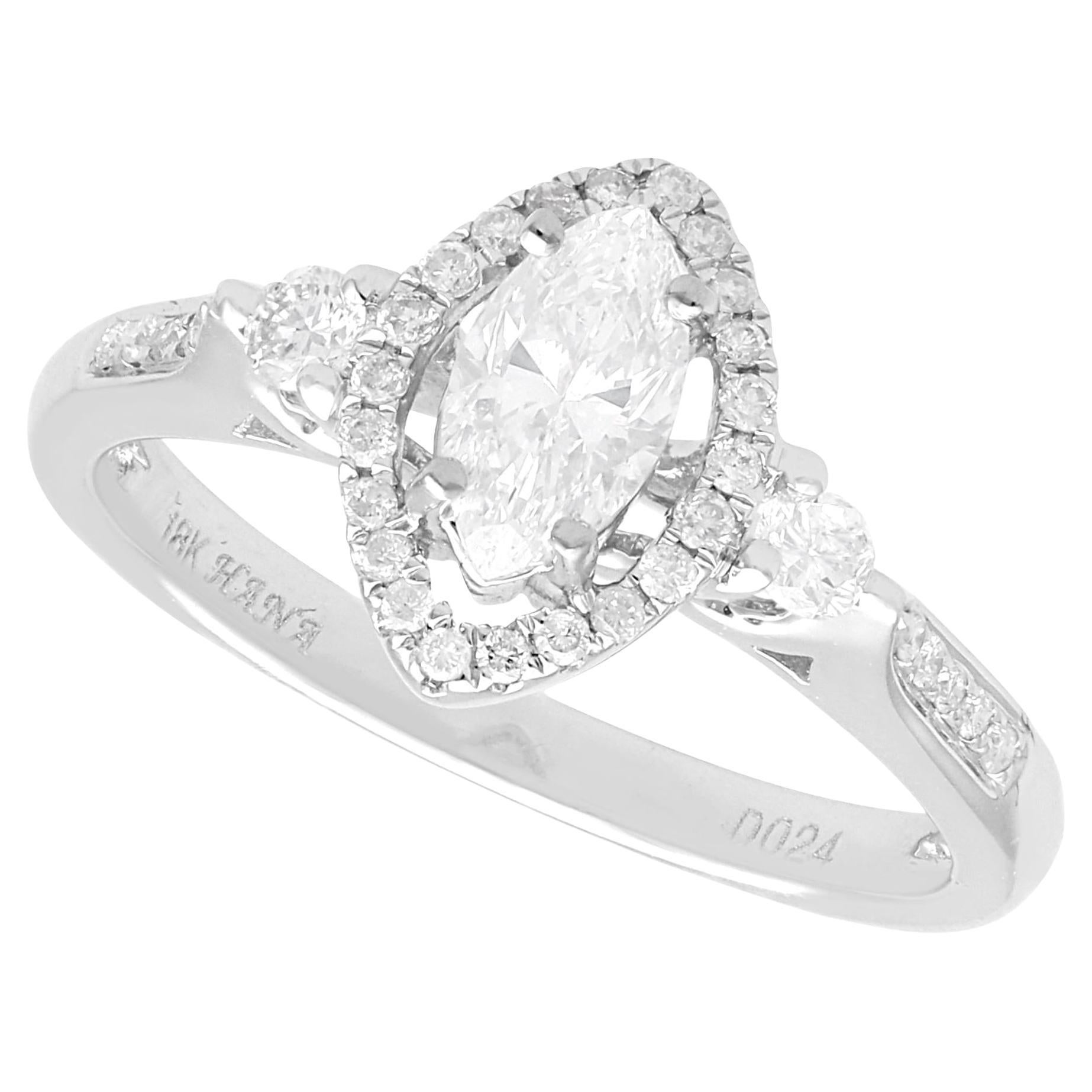 1980s 0.83 Carat Diamond and 18k White Gold Halo Ring For Sale