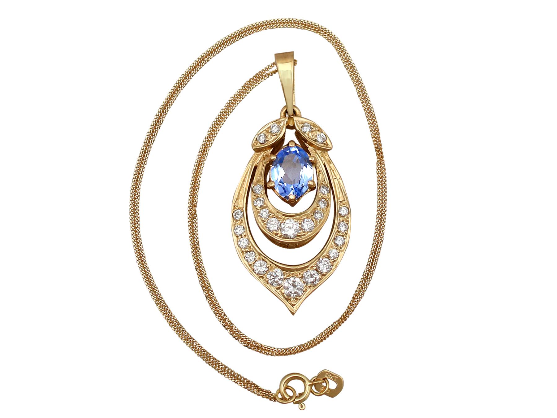 A fine and impressive 1.10 carat aquamarine and 0.92 carat diamond, 18 karat yellow gold pendant; part of our diverse vintage jewelry and estate jewelry collections.

This fine and impressive oval cut pendant has been crafted in 18k yellow