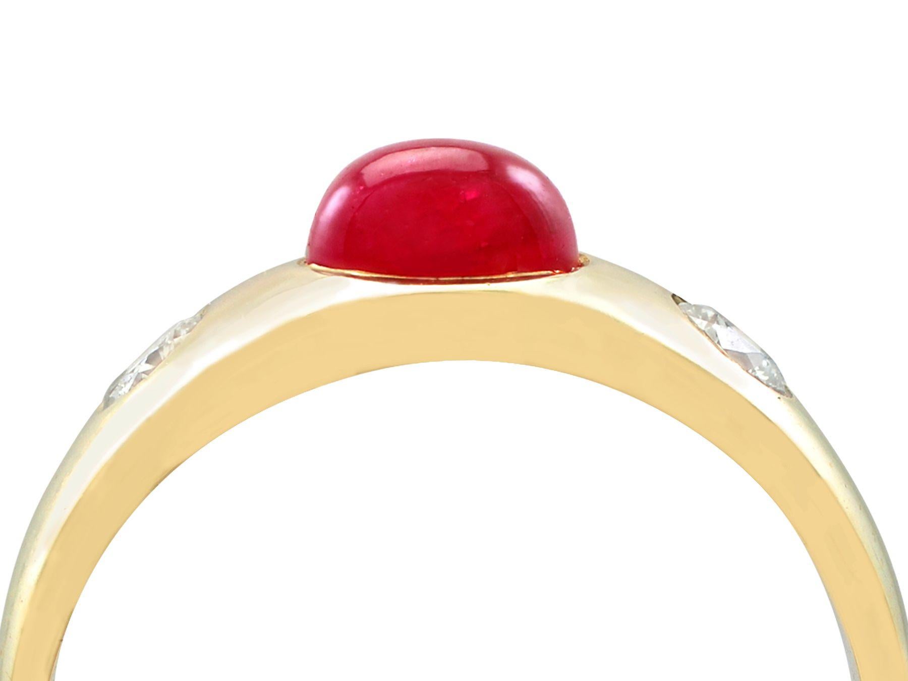An impressive vintage 1980s 1.29 carat ruby and 0.42 carat diamond, 14 karat yellow gold trilogy ring; part of our diverse vintage jewelry and estate jewelry collections.

This fine and impressive vintage cabochon cut ruby ring has been crafted in