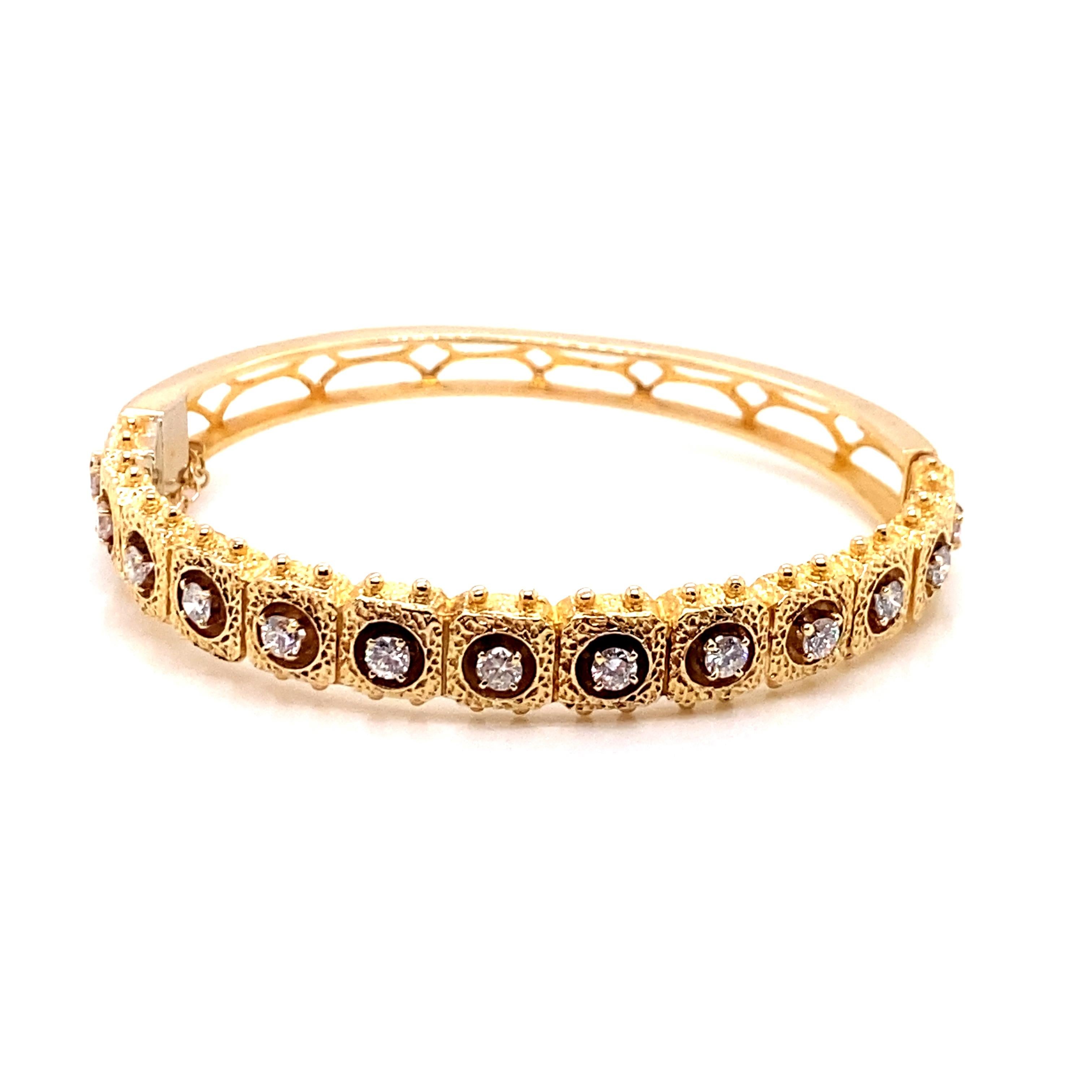 Vintage 1980's 14K Yellow Gold Diamond Bangle 1.05ct - The bracelets contains 13 round brilliant diamonds which are set in 4 prong heads with an approximate weight of 1.05ct. The diamond quality is G - H color SI clarity. The width of the bangle is
