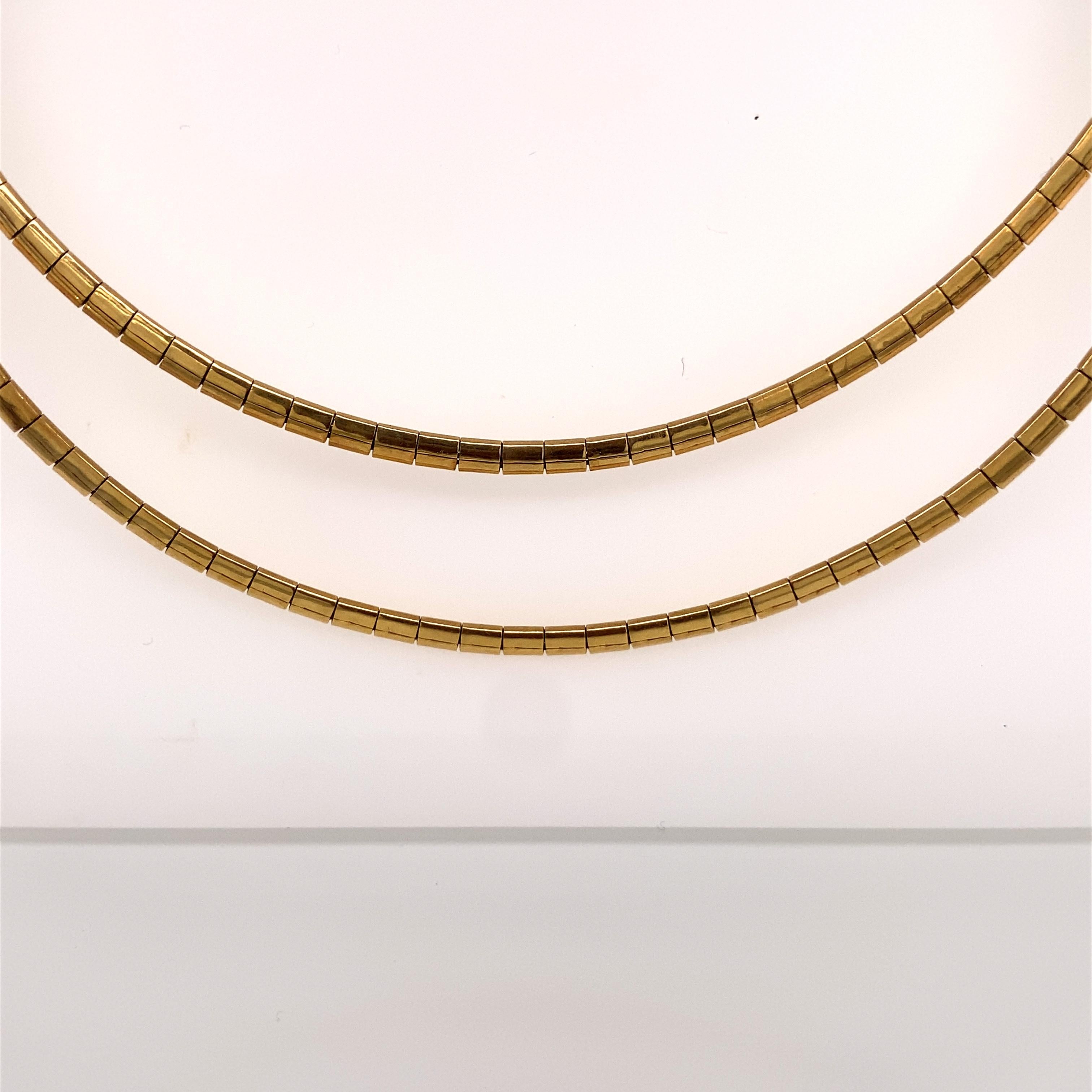 Vintage 1980's 14K Yellow Gold Layered Omega Necklace - The necklace measures 15.5 inches long, the 2nd chain drops down another .75 inches and the width is 2.5mm. The necklace has a plunger clasp with a safety latch. The necklace weighs 20.6 grams.