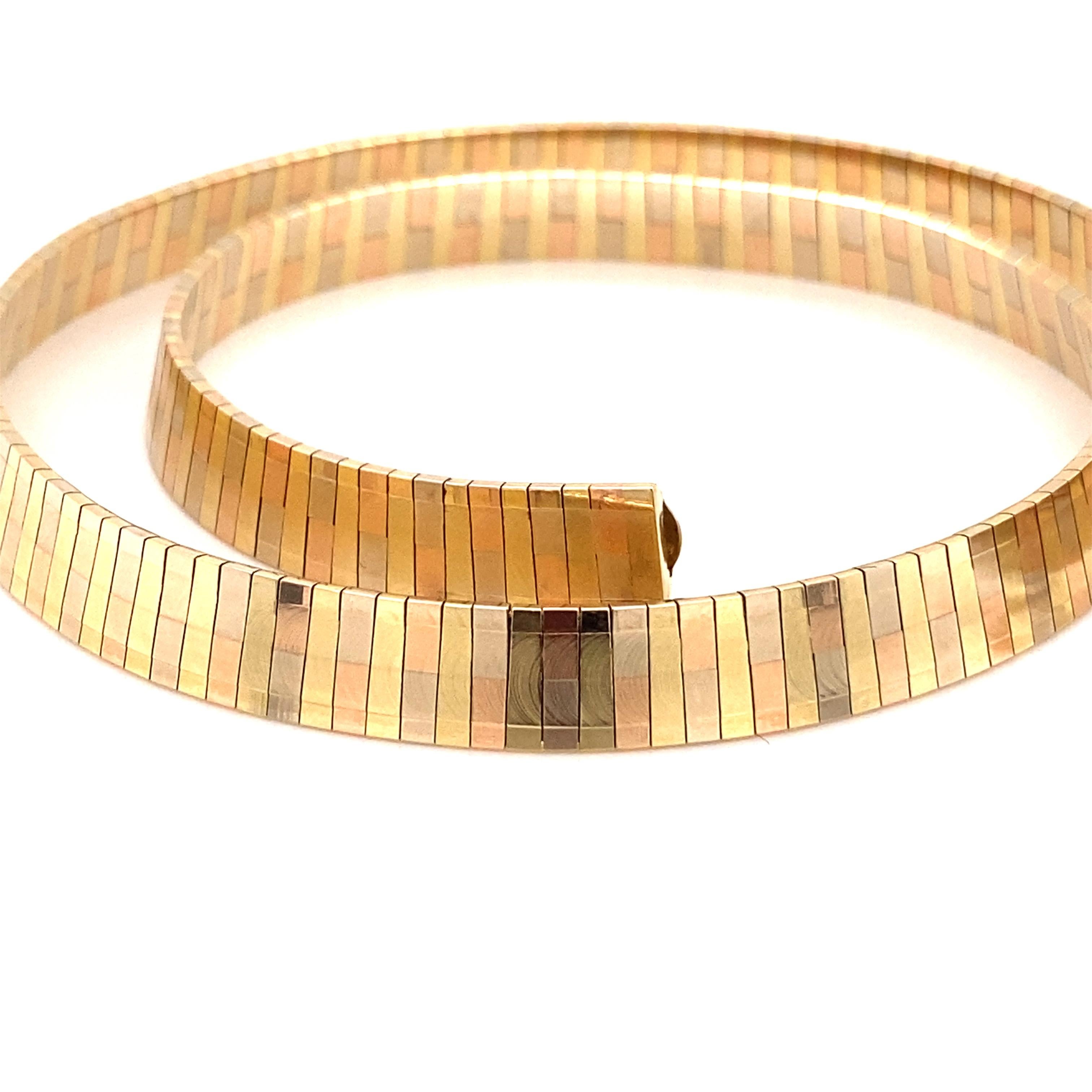 Vintage 1980’s 14K Yellow Gold Tri-Color Omega Choker Necklace - The Italian made necklace has alternating rose gold, yellow gold and white gold and lays beautiful on the neck. The necklace is 8mm wide and features a plunger clasp with a figure 8