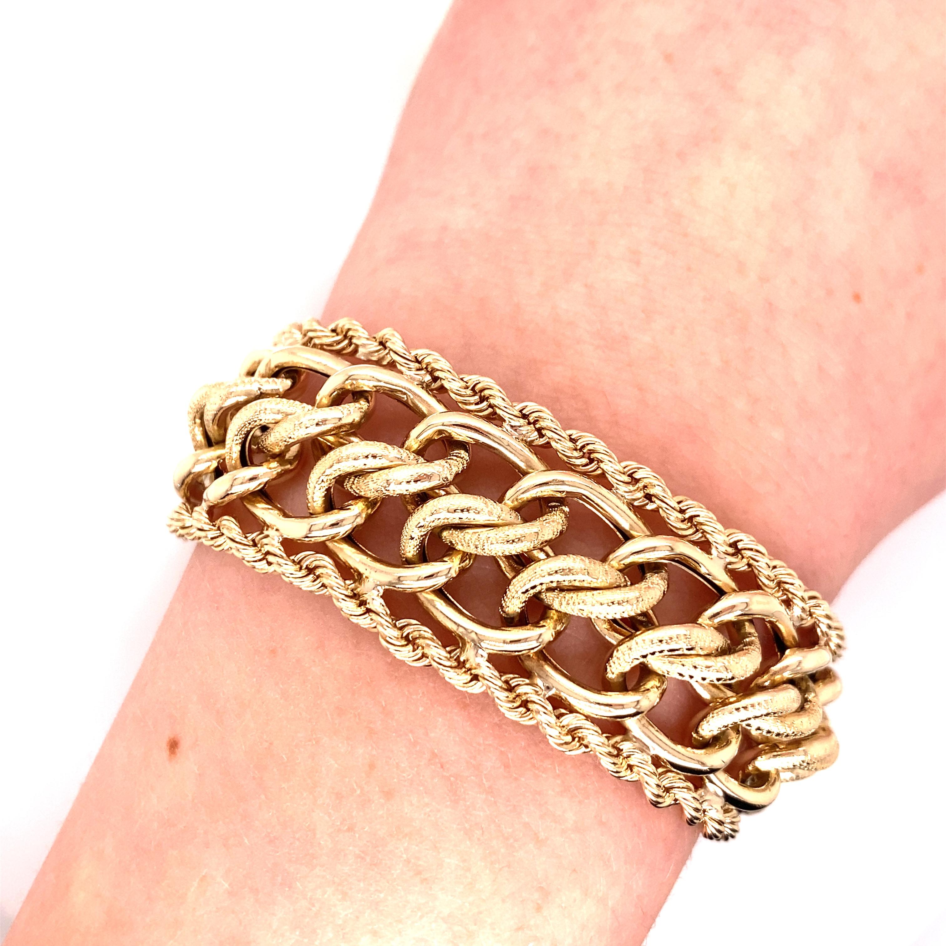 Vintage 1980's 14K Yellow Gold Wide Link With Rope Edge Bracelet - The bracelet measures .75 inches wide and 7.25 inches long. It has a hidden plunger clasp with a figure 8 safety catch. The bracelet weighs 50.72 grams.