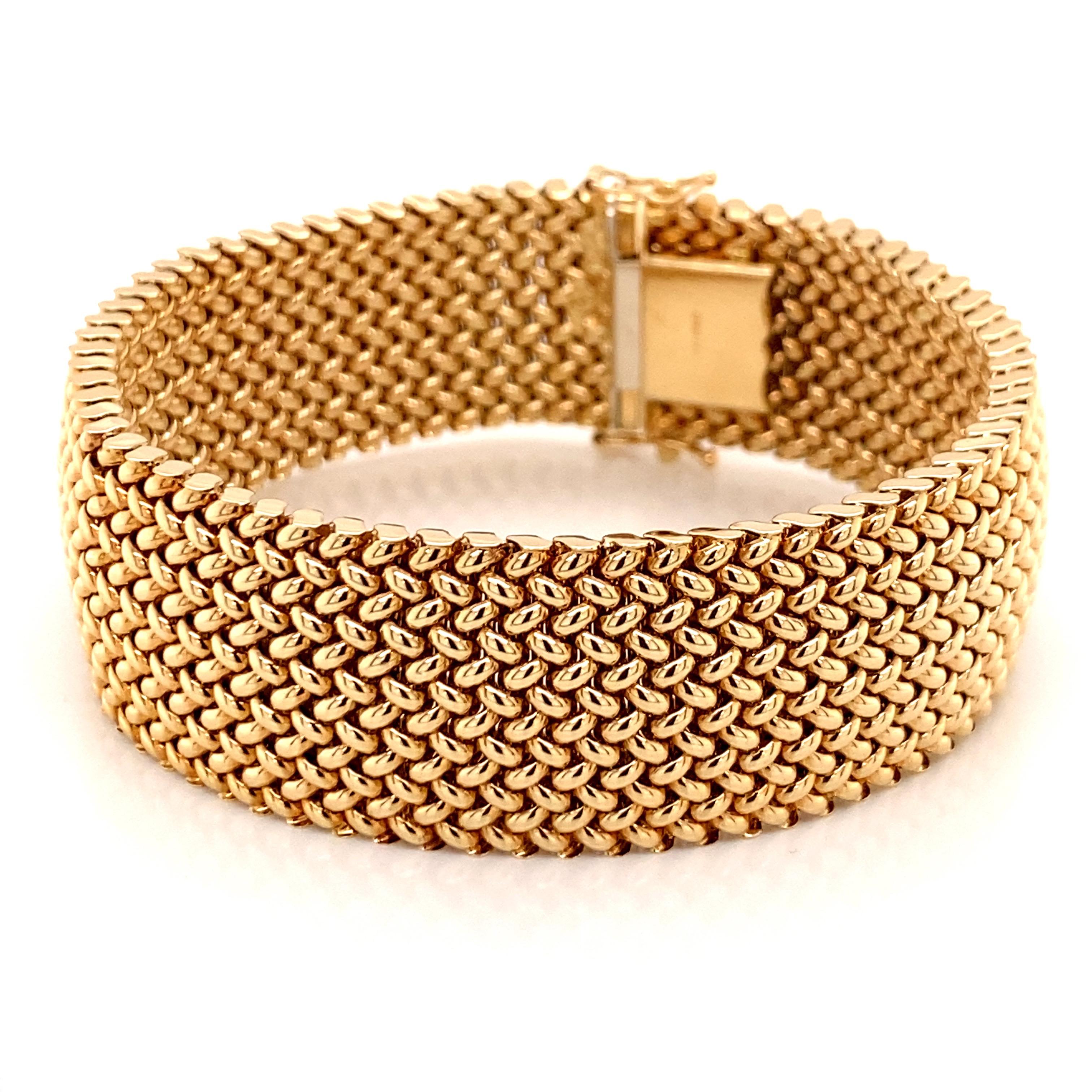 Vintage 1980's 14K Yellow Gold Wide Mesh Bracelet - The Italian made bracelet measures 7 1/2 inches long and 7/8 inches wide. The clasp is a hidden barrel clasp with 2 safety figure 8's. The bracelet weighs 38.5 grams.