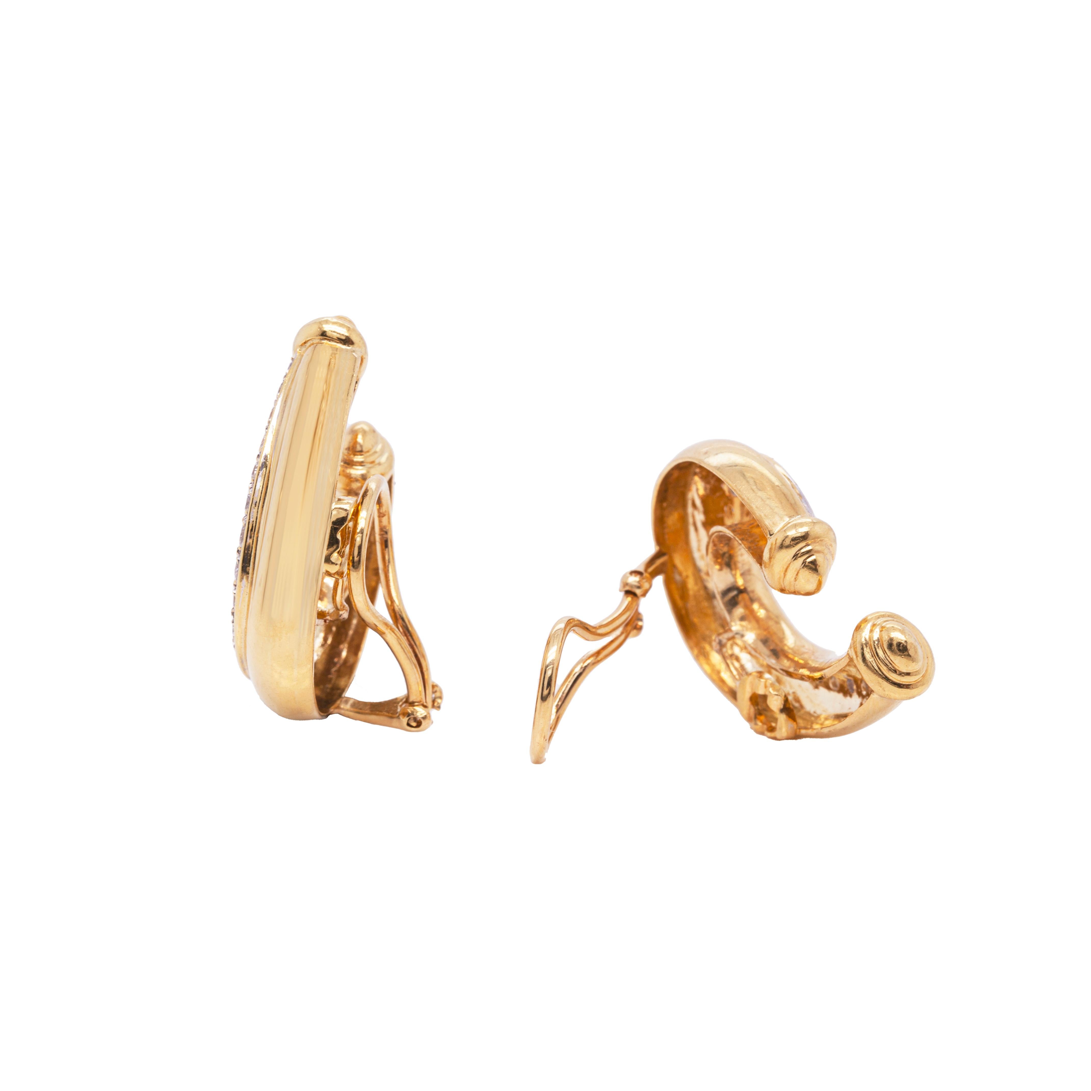 These striking 1980's earrings are set with a total of approximately 0.90 carat of fine quality round brilliant cut diamonds across the pair. The asymmetric design, masterfully crafted from solid 18 carat yellow gold, makes them a fabulous choice