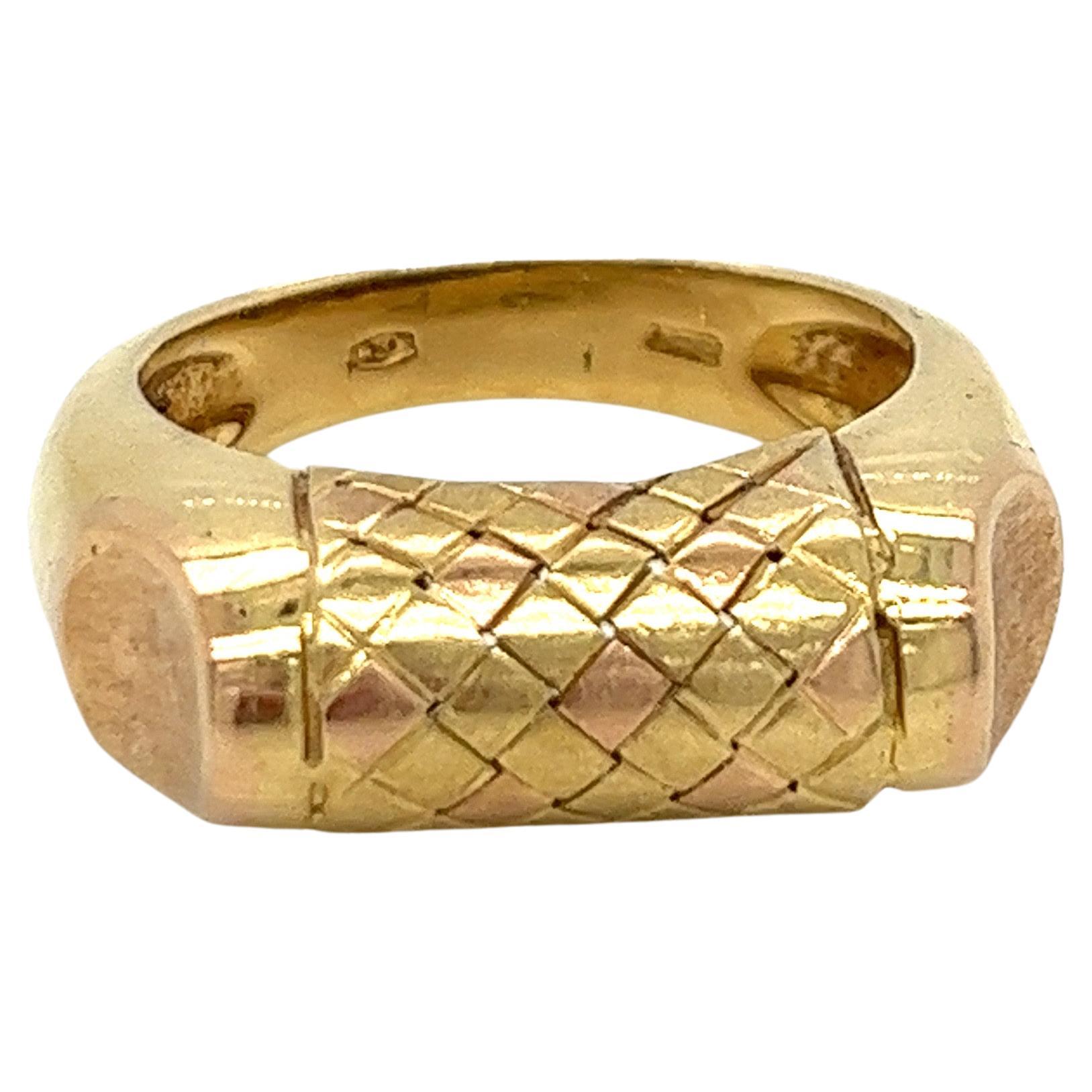 Vintage 1980's 18k Yellow Gold and Rose Gold Statement Ring. The center design has a brushed finish basket weave of rose gold and yellow gold. The side accents are brushed finish rose gold and the rest of the ring is shiny yellow gold. The width of