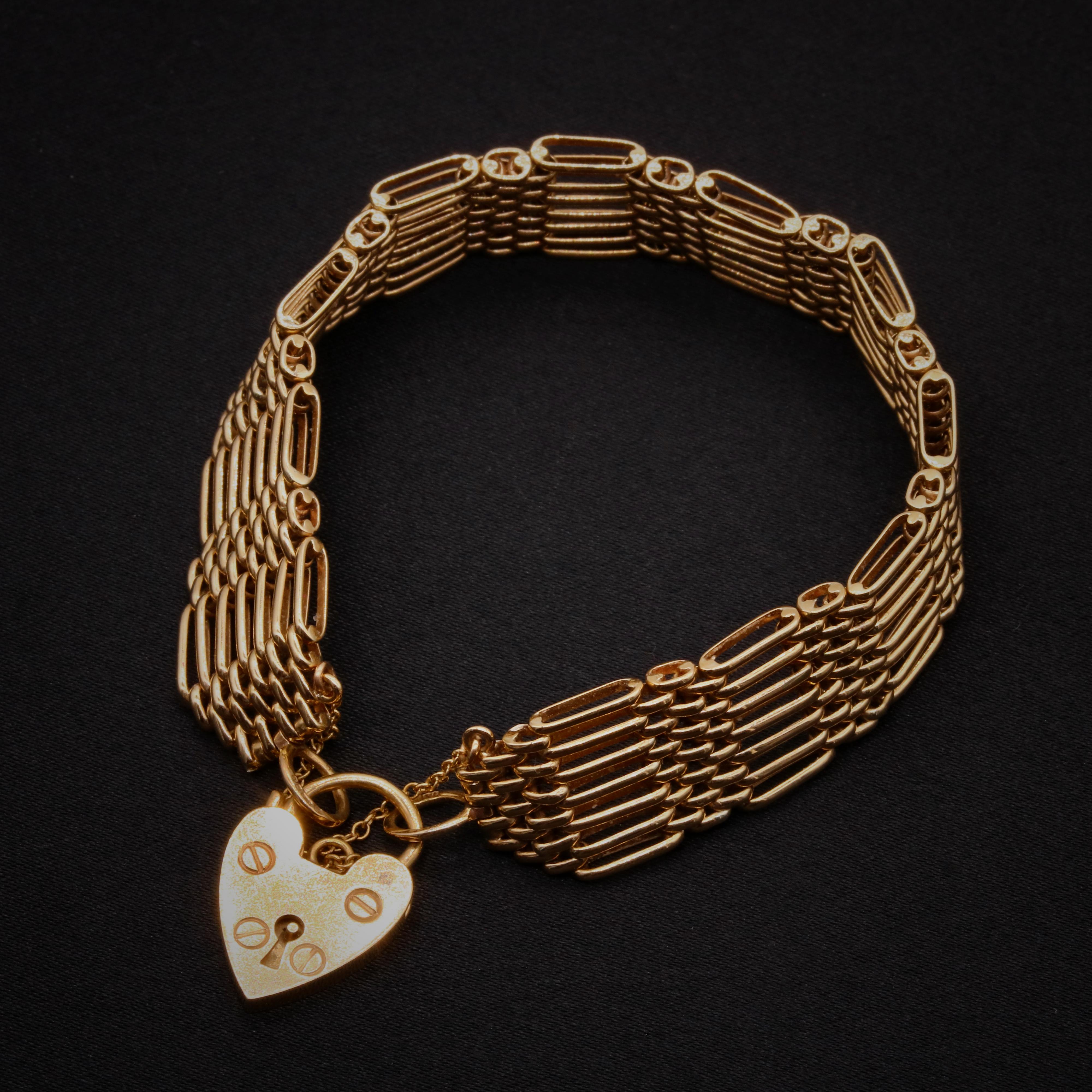 A vintage yellow gold bracelet, comprising short and long links, a padlock clasp, and safety chain, in 9 karat yellow gold.

This lovely bracelet is made up of long and short gate links. The long links are each formed as 6 bars, the short links are
