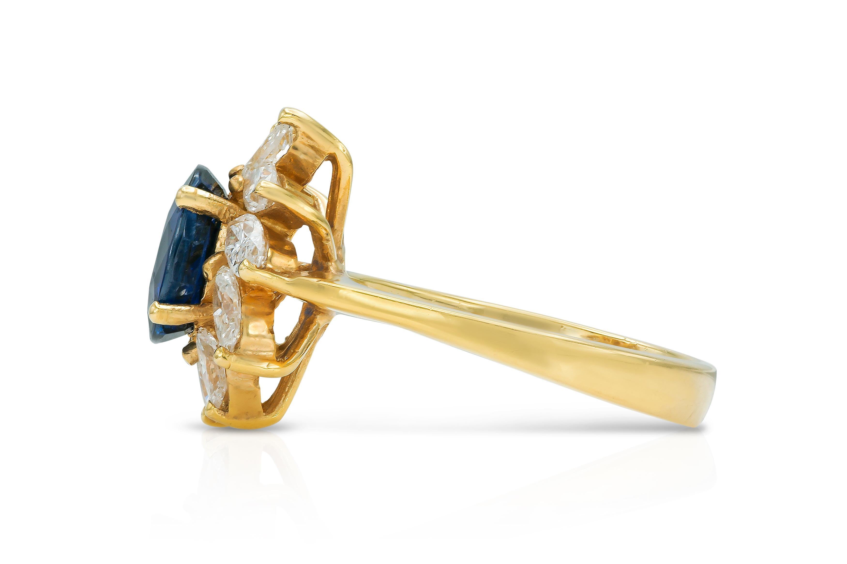 Vintage 1980s 2.54 Carat Oval Cut Sapphire and 1.16 Carat Marquise Diamonds Ring In Good Condition For Sale In New York, NY