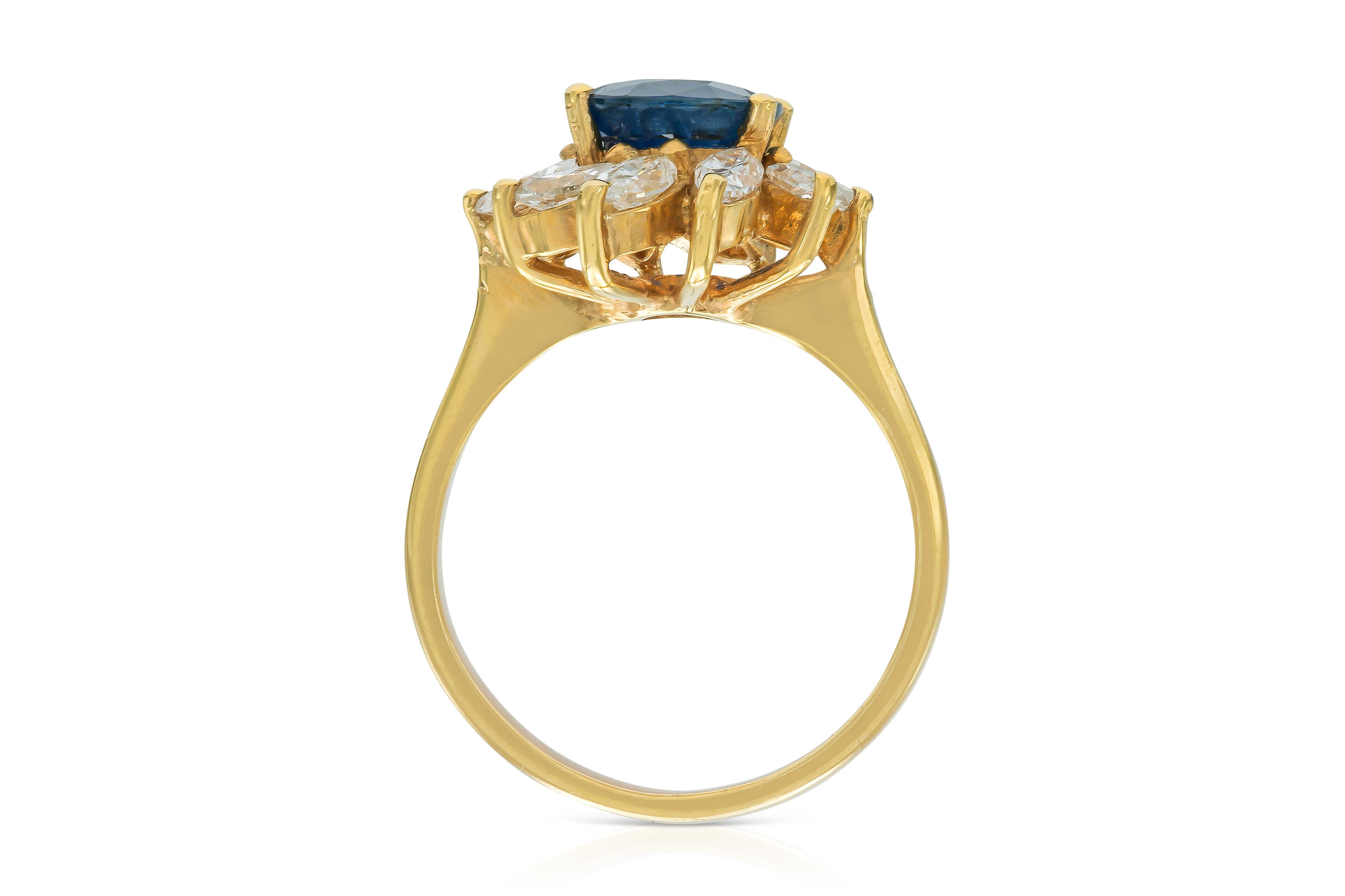 Women's Vintage 1980s 2.54 Carat Oval Cut Sapphire and 1.16 Carat Marquise Diamonds Ring For Sale