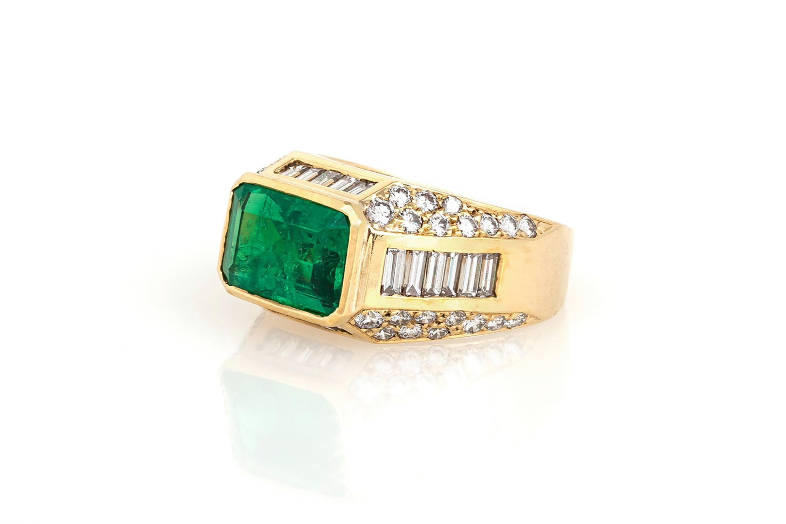 Finely crafted in 18k yellow gold with an East-West set Emerald cut Emerald weighing 3.06 carats and accenting Round Brilliant and Baguette cut Diamonds weighing a total of 2.04 carats.
Circa 1980s
Size 6 3/4, resizable