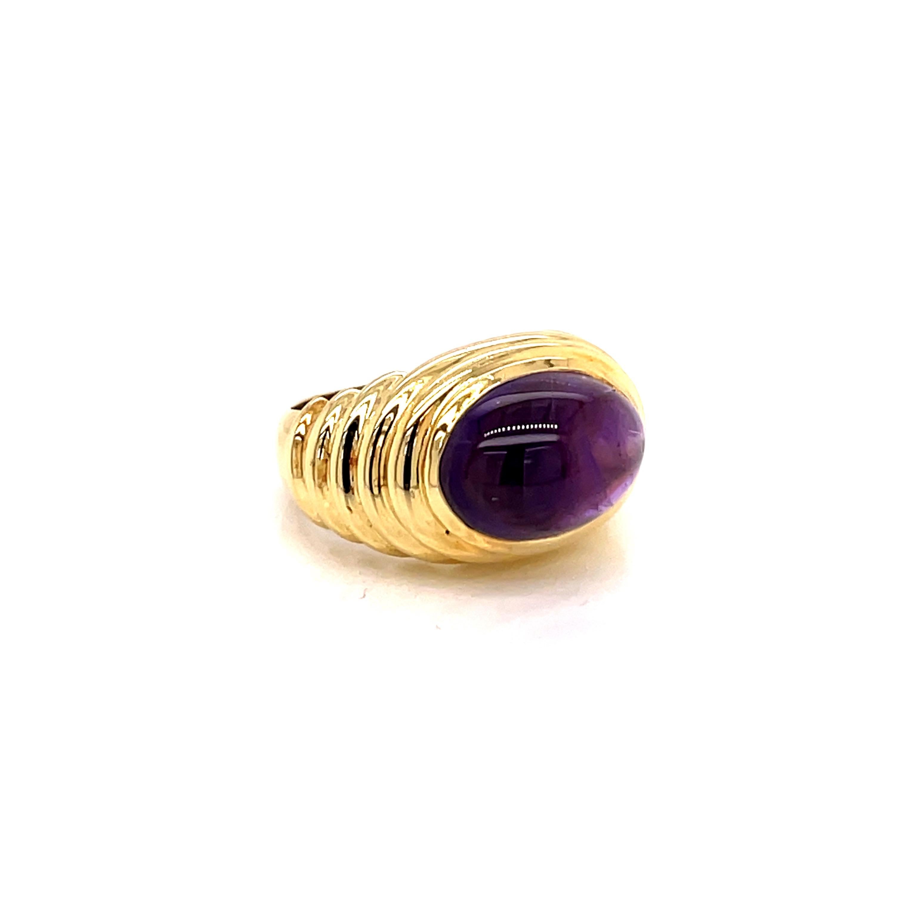 Vintage 1980's 5ct Oval Cabochon Amethyst Ring  - the amethyst weighs approximately 5ct and measures 13.5 x 9.5mm.   The setting is 18k yellow gold with a finger size 6 which can be sized upon request.  The ring weighs 10 grams