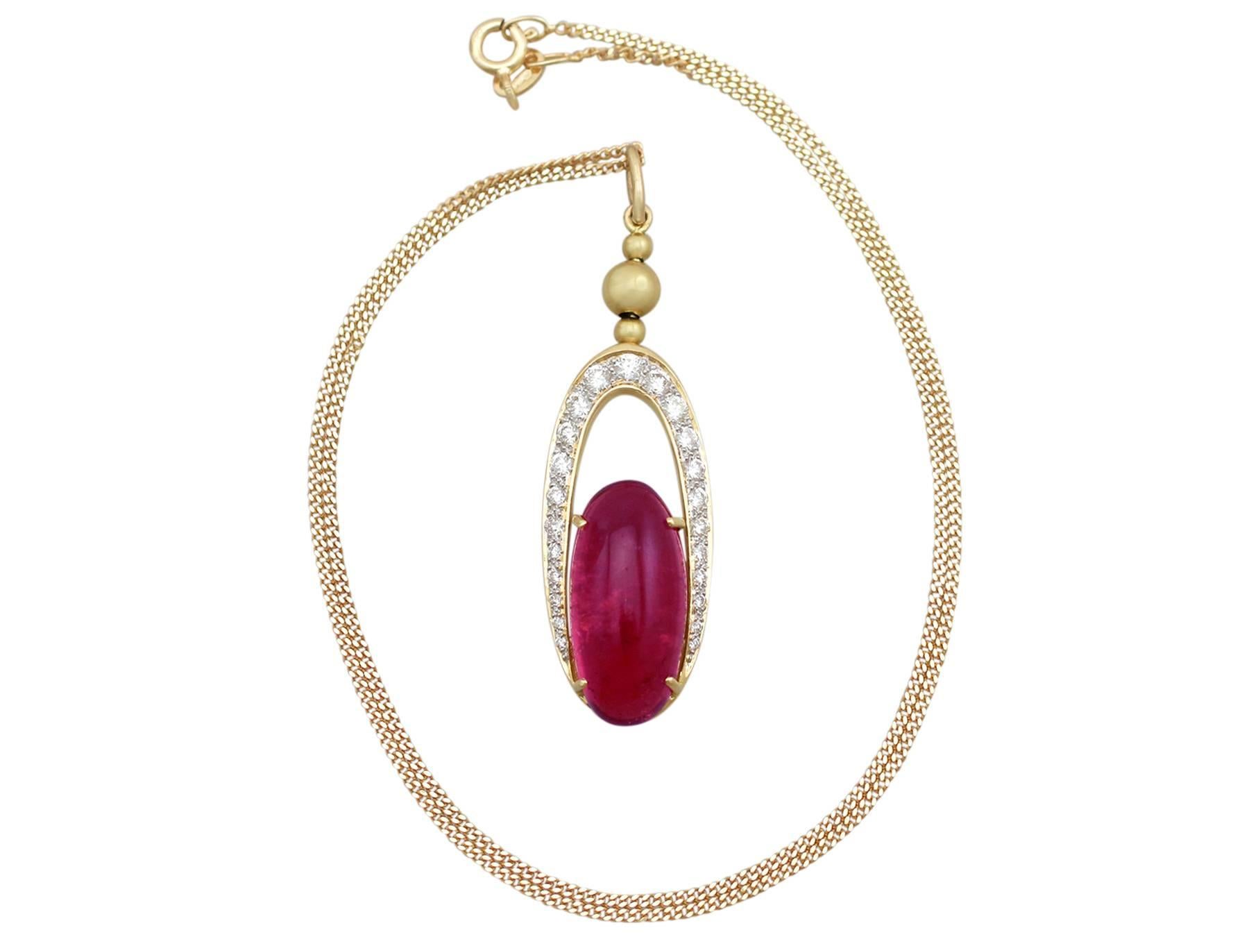 A stunning 9.36 carat pink tourmaline and 0.60 carat diamond, 18 karat yellow gold and 18 karat white gold set pendant; part of our diverse gemstone jewelry collections.

This stunning, fine and impressive gold cabochon cut tourmaline pendant has