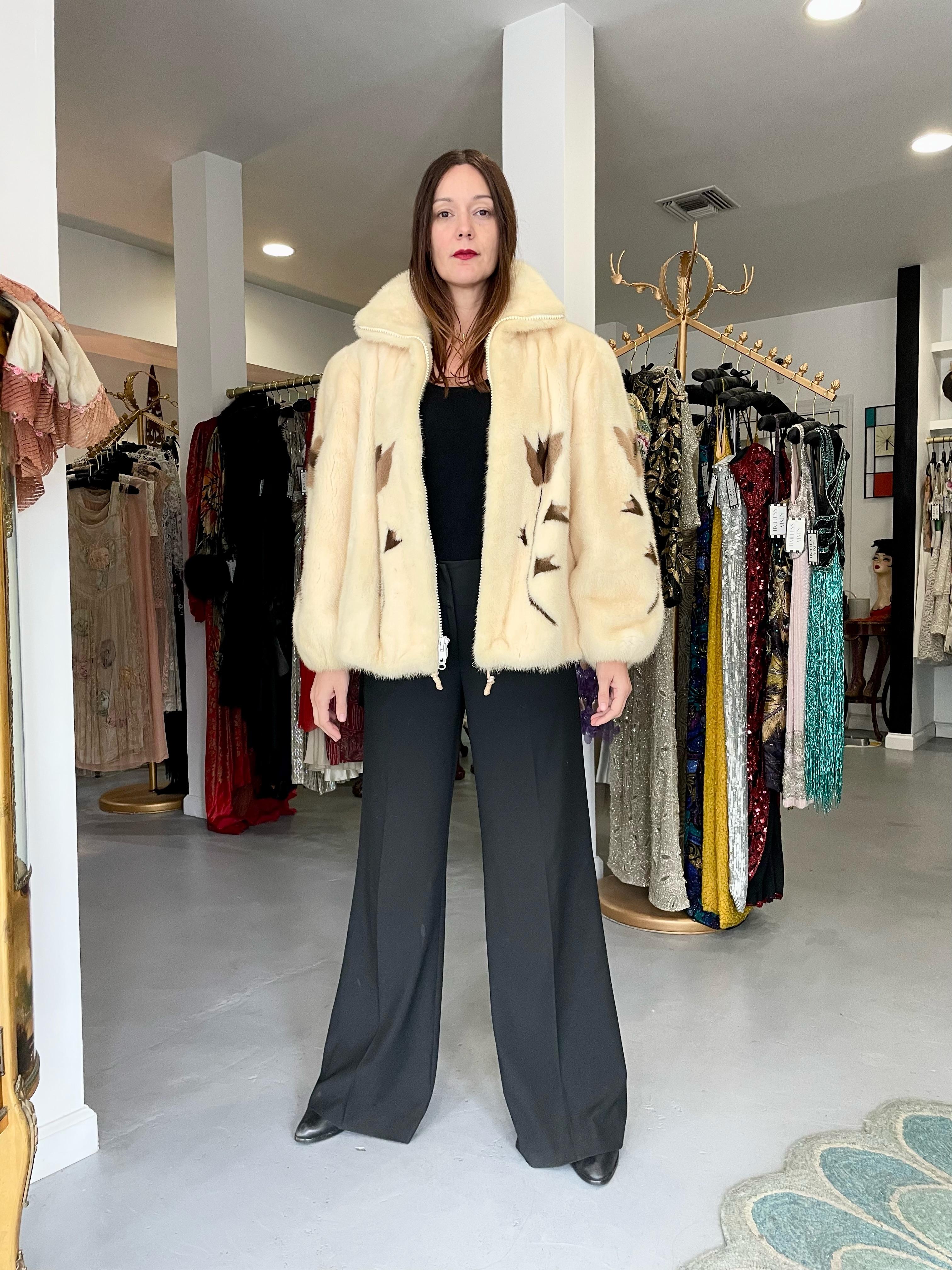 An ultra rare and truly breathtaking Balenciaga haute couture blonde colored genuine mink fur bomber jacket dating back to the late 1980's. It is easy to see the level of quality in this magnificent piece; the fur is extremely supple and soft. The