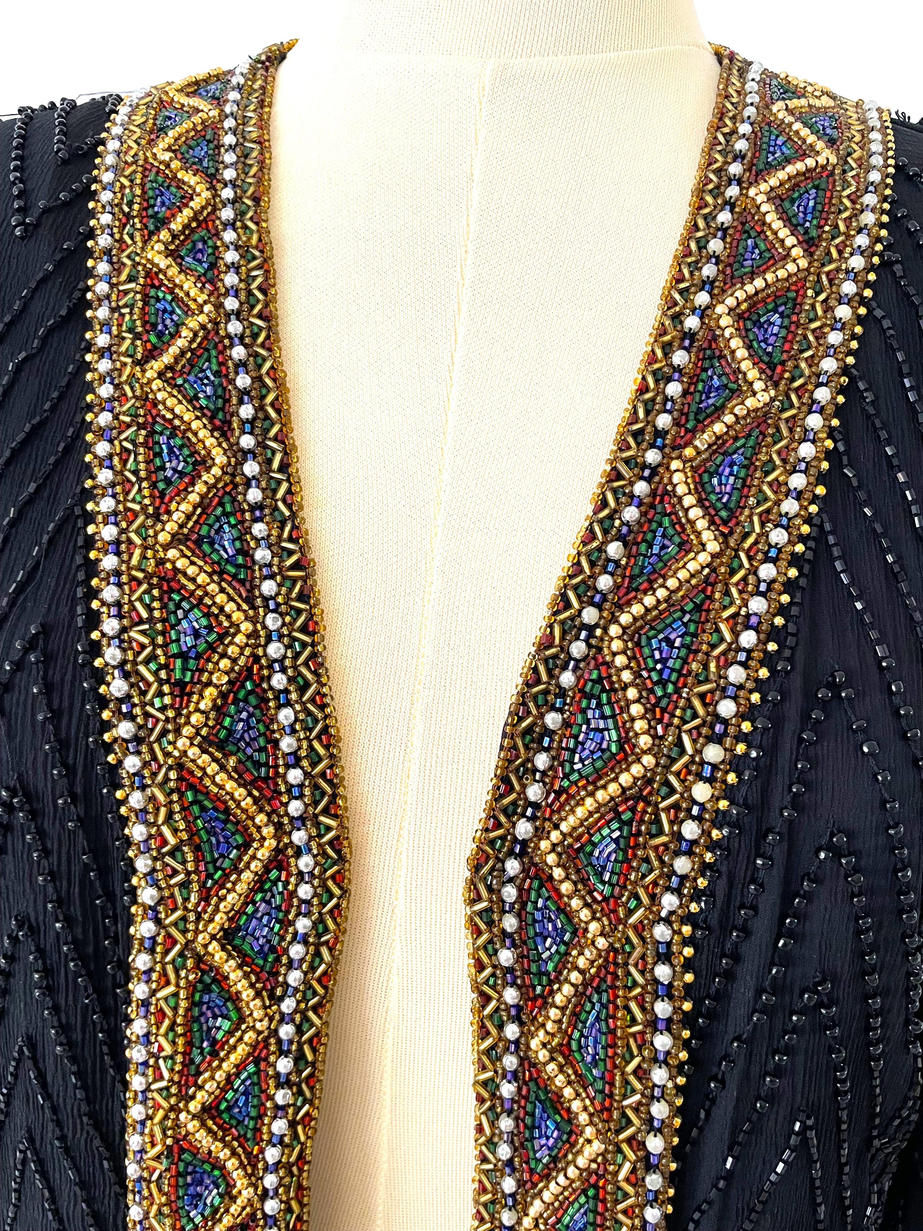 An 80s Vintage Black Beaded Trophy Cocktail Jacket is a striking piece of evening wear with distinct elements from both the 1980s and earlier eras, often combining bold 80s fashion with intricate vintage craftsmanship. 
The most significant element