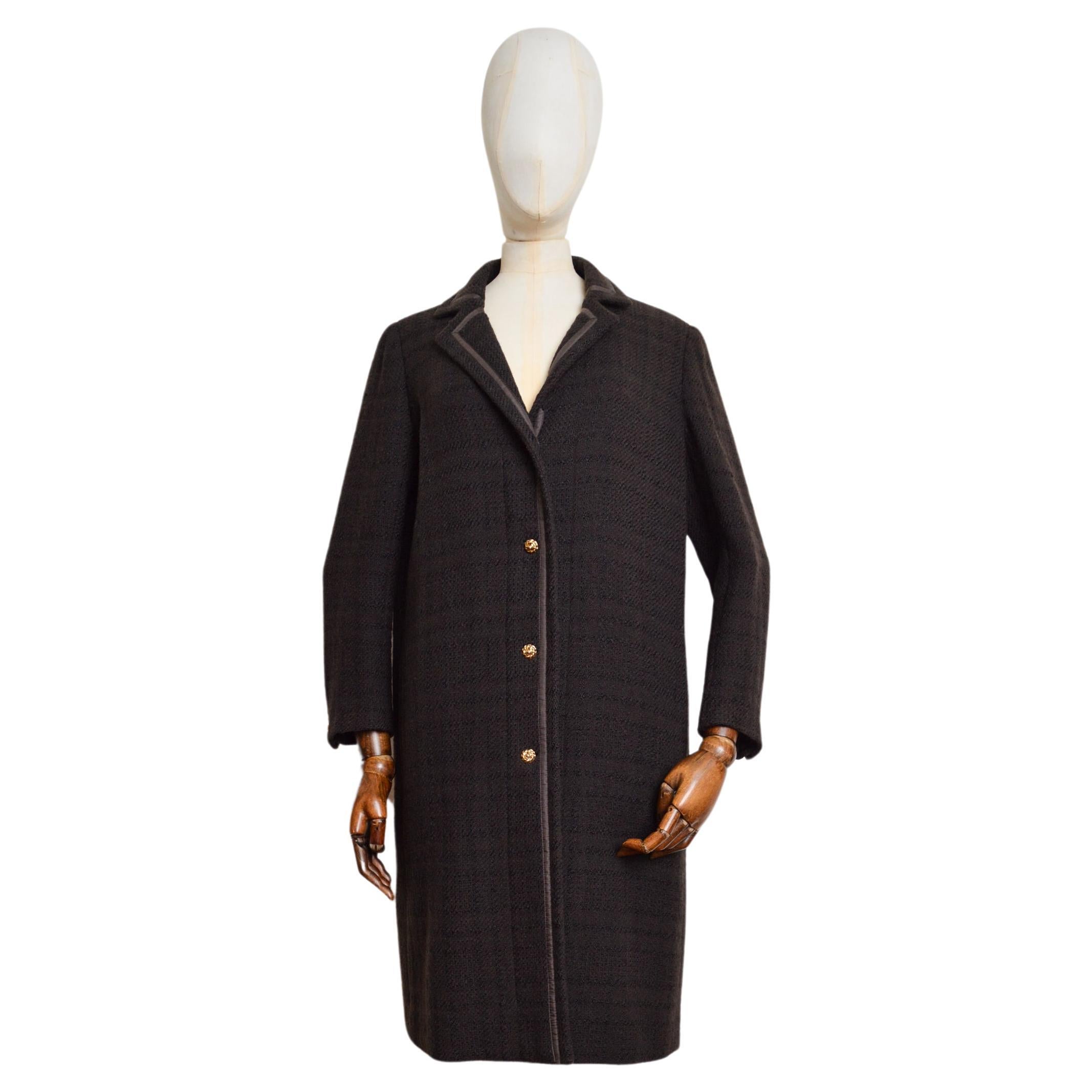 Chic Vintage CHANEL Chocolate Brown Wool & Silk Chesterfield Coat, Circa 1980.  

MADE IN FRANCE.  

This Timeless, Understated, Vintage CHANEL Coat features long sleeves, Gold Flower Shaped 'Chanel' stamped buttons, a simple Pure Silk lining, and