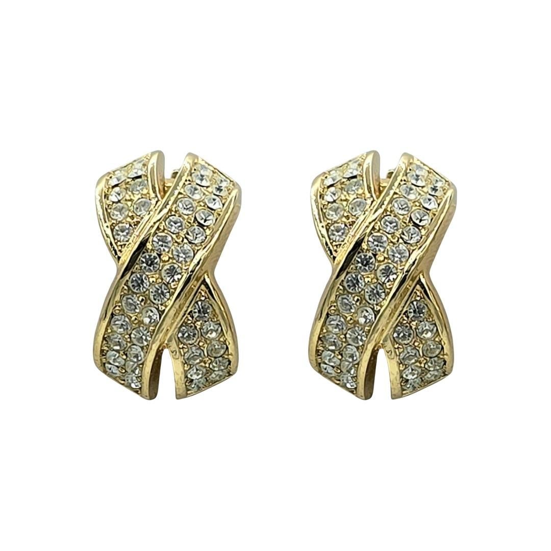A beautiful Earrings and Necklace Set from Christian Dior.  This is vintage from circa 1980's and is in pristine condition.  The necklace has a tapered omega chain with an adjustable clasp.  The centrepiece has a ribbon design, adorned with
