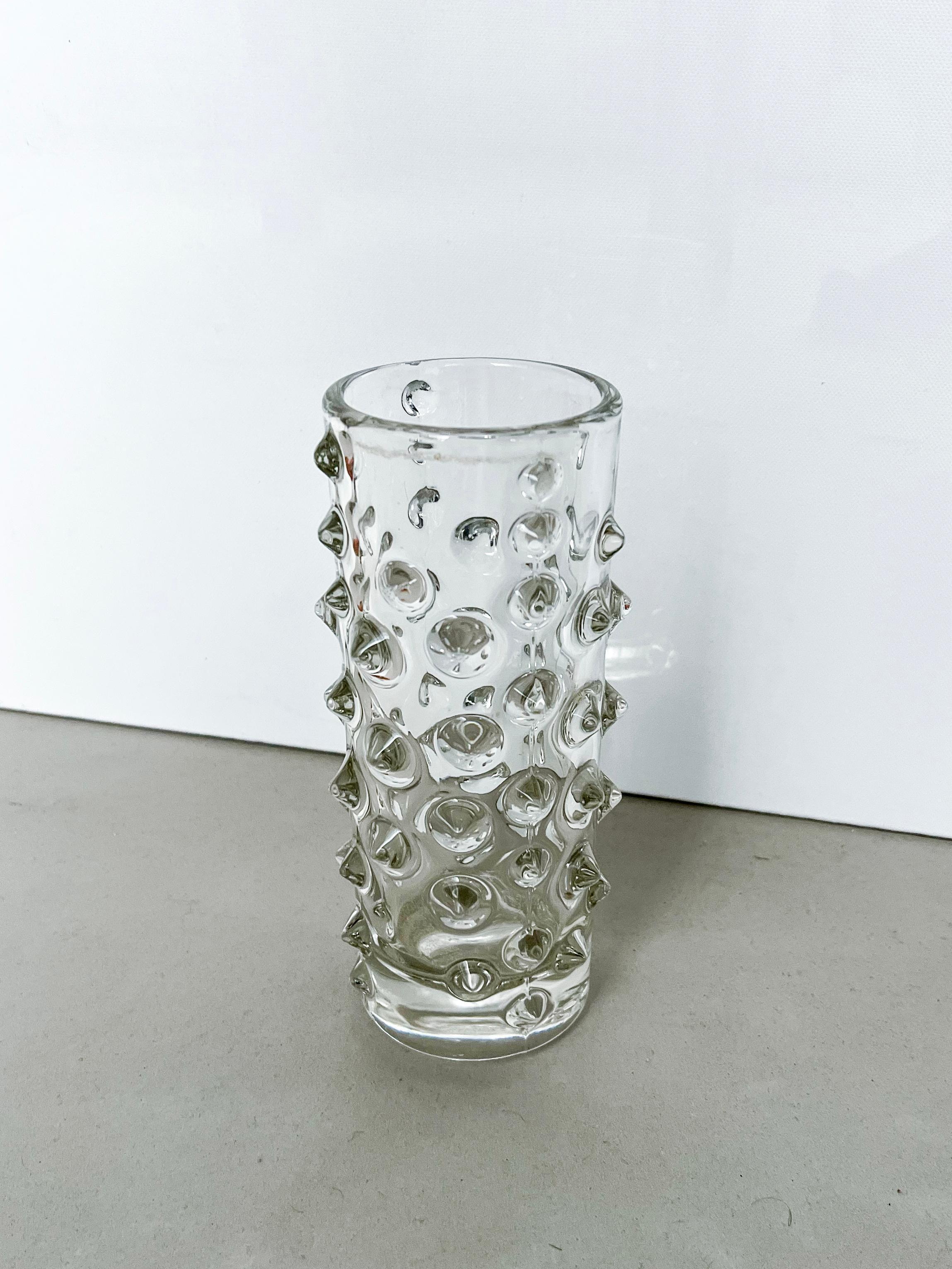 Big collectible vase - decorative vase with spikes - collectible glass sculpture

Offered for sale is a vintage vase made in clear cast glass and decorated with a series of spikes, geometrically radiating from the surface of the piece. It was likely