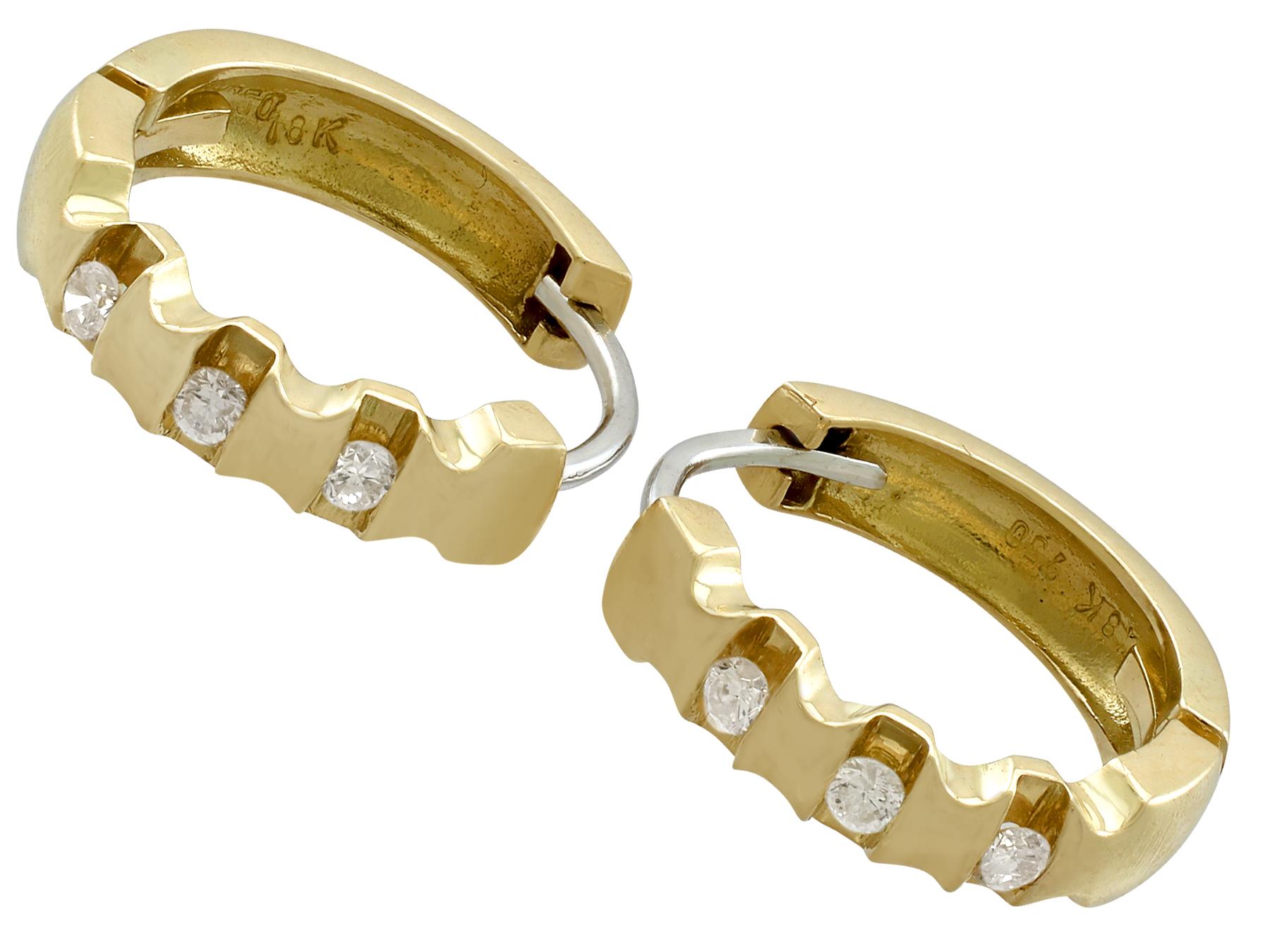 An impressive pair of vintage 1980s 0.24 carat diamond and 18 karat yellow gold hoop earrings; part of our diverse diamond jewelry and estate jewelry collections.

These fine and impressive vintage diamond earrings have been crafted in 18k yellow