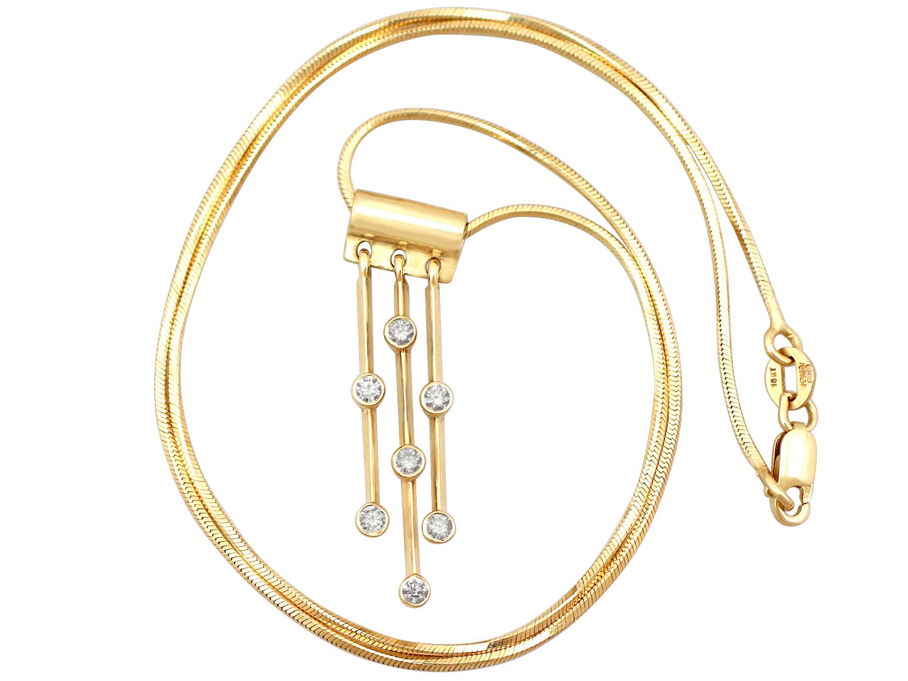 A fine and impressive vintage 0.33 carat diamond and 18 karat yellow gold drop pendant; part of our vintage jewelry and estate jewelry collections.

This impressive vintage diamond drop pendant has been crafted in 18k yellow gold.

The pendant