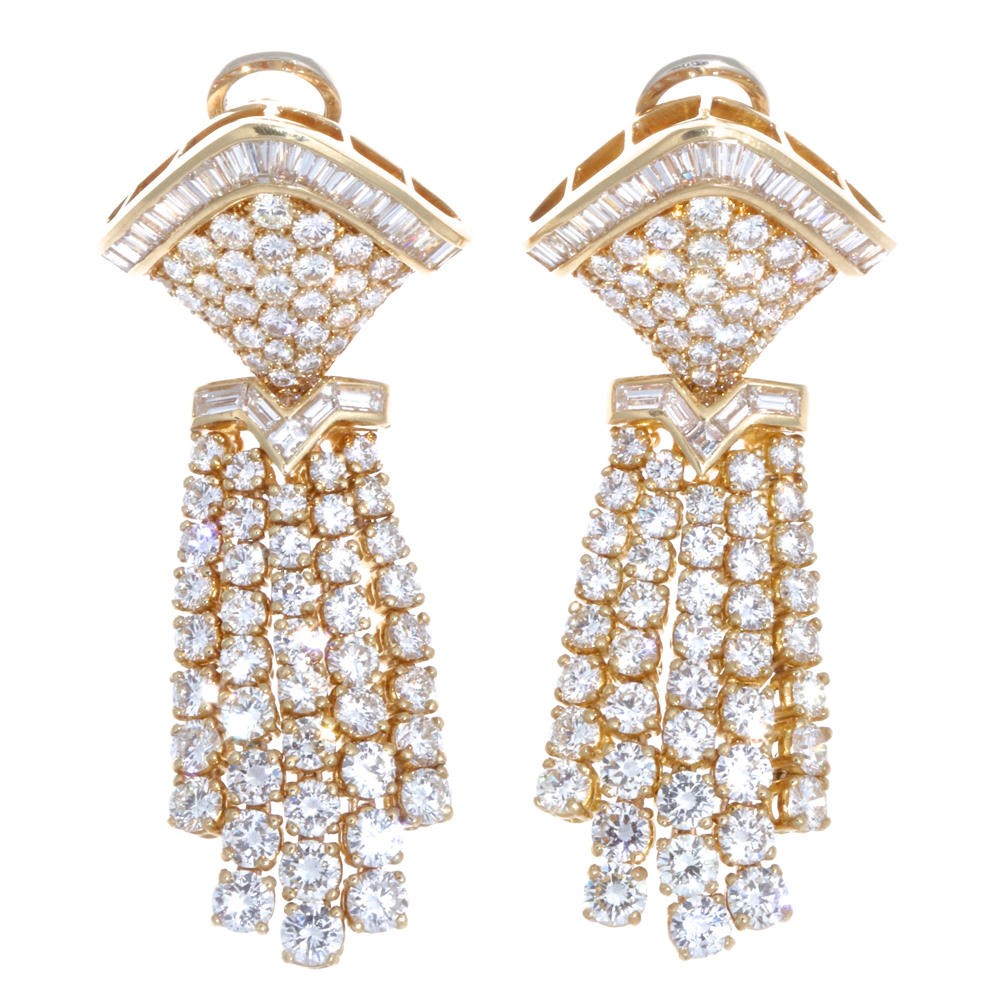 A truly 1980's classic. These vintage diamond 18k gold chandelier earrings will draw all the attention towards you. An accessory that elevates their owner and attracts attention all around. The earrings feature approximately 13.50 carats of round