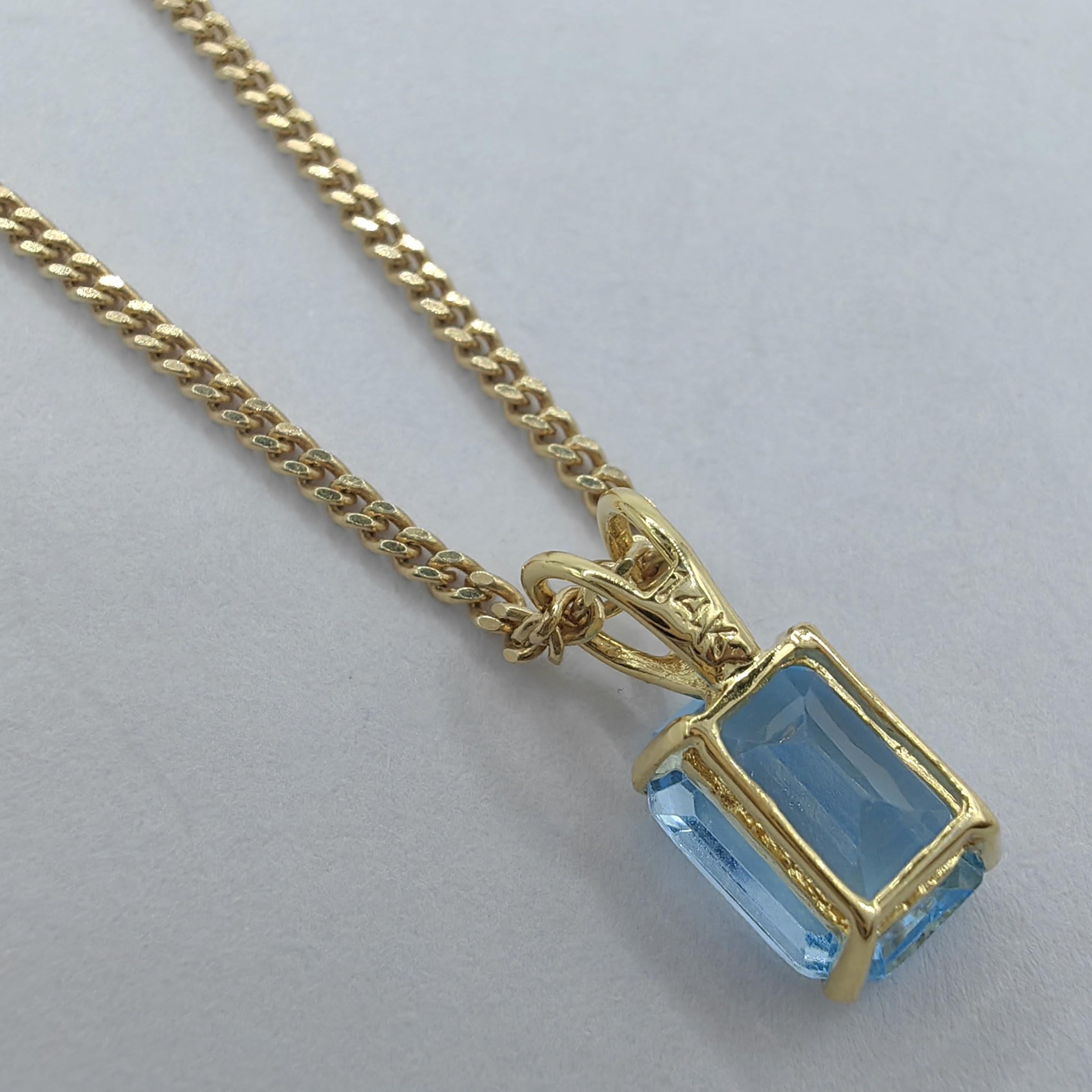 Contemporary Vintage 1980's Emerald Cut Blue Topaz Necklace Pendant in 14K Yellow Gold #1 For Sale